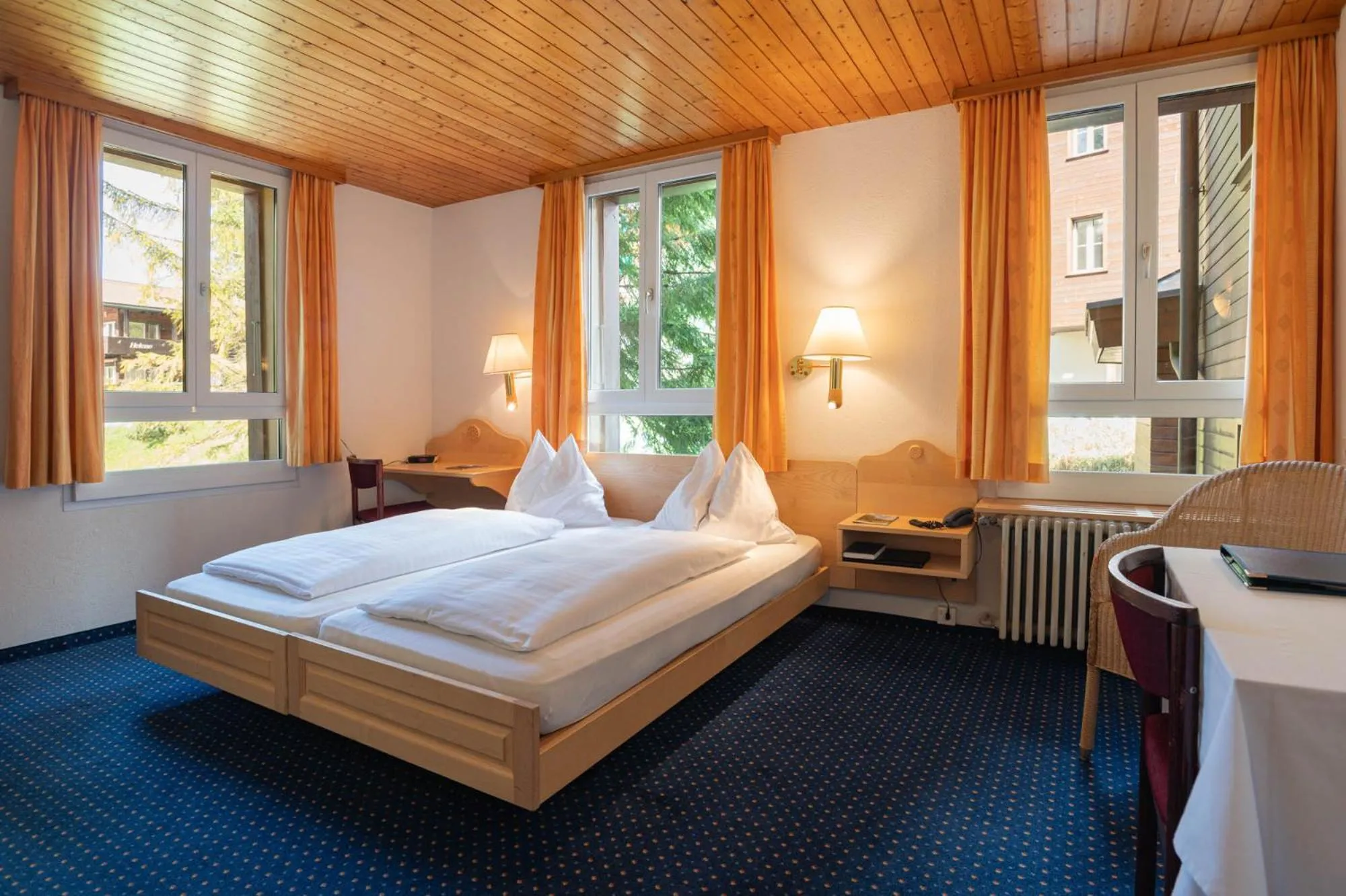 Bed in Hotel Bellevue - Traditional Swiss Hideaway