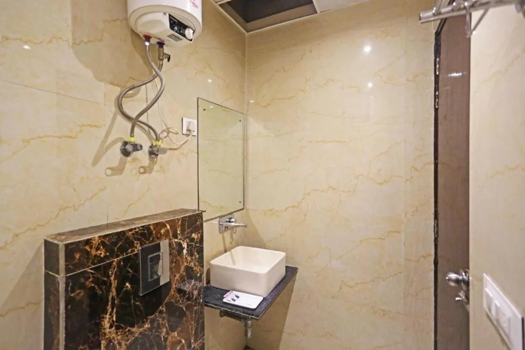 Toilet in Comfy Stay Hotels 2nd Floor