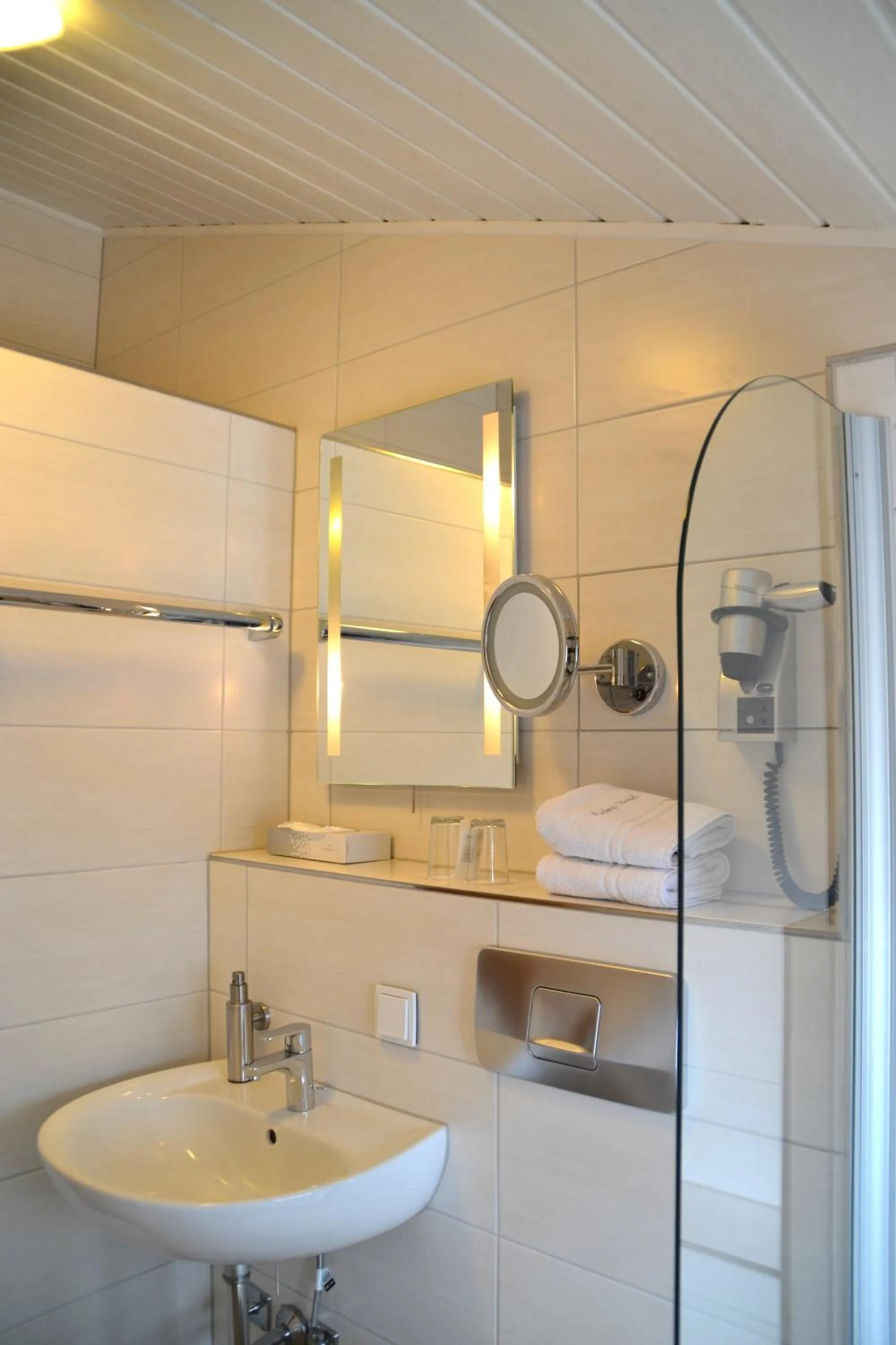 Bathroom in Alpina Hotel