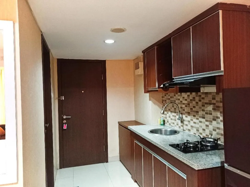 Kitchen or kitchenette in Cozy The H Residence Cawang by Bonzela Property