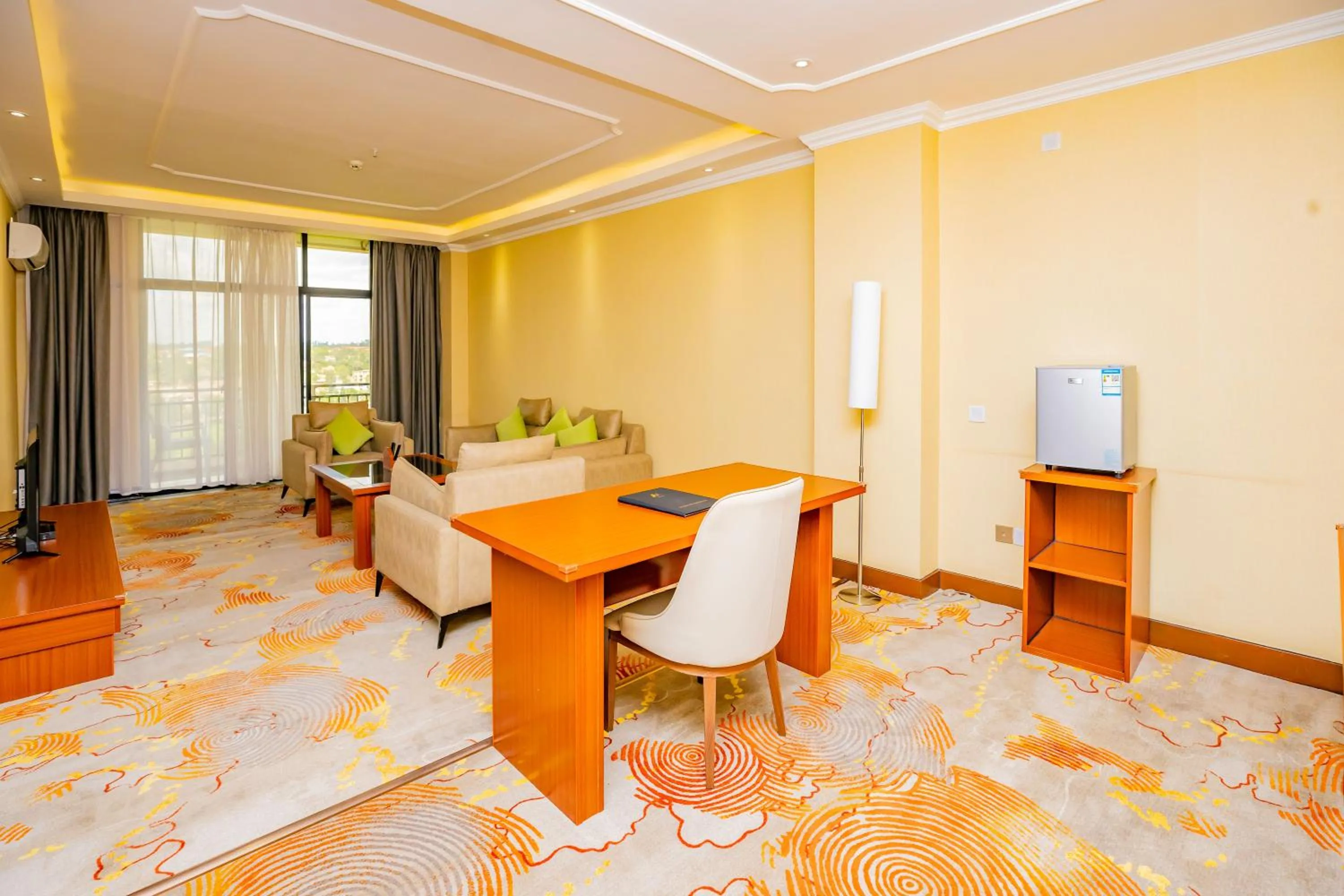 Living room, Bed in M Hotel Kigali