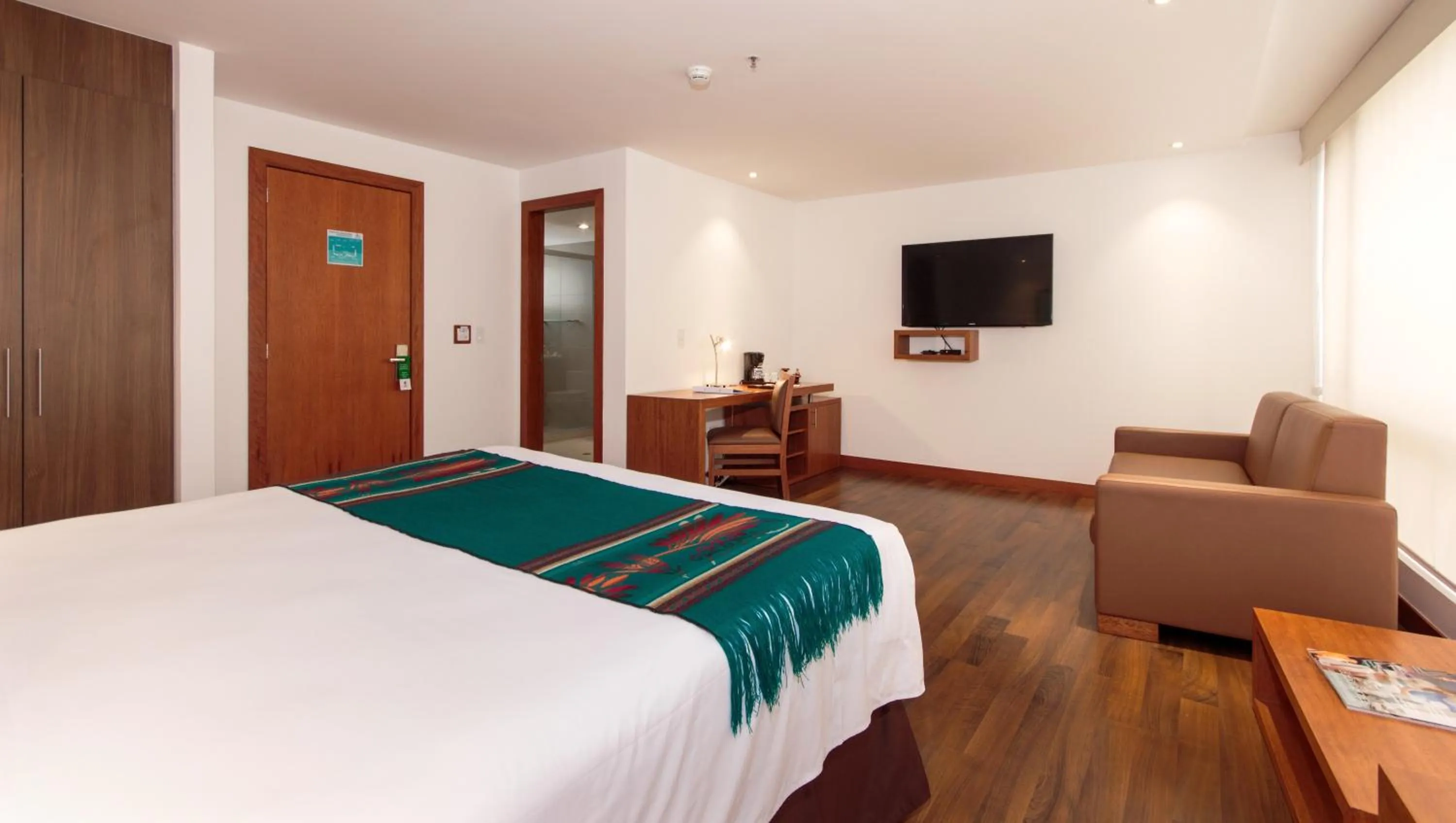 Communal lounge/ TV room, Bed in ZEN Hotel