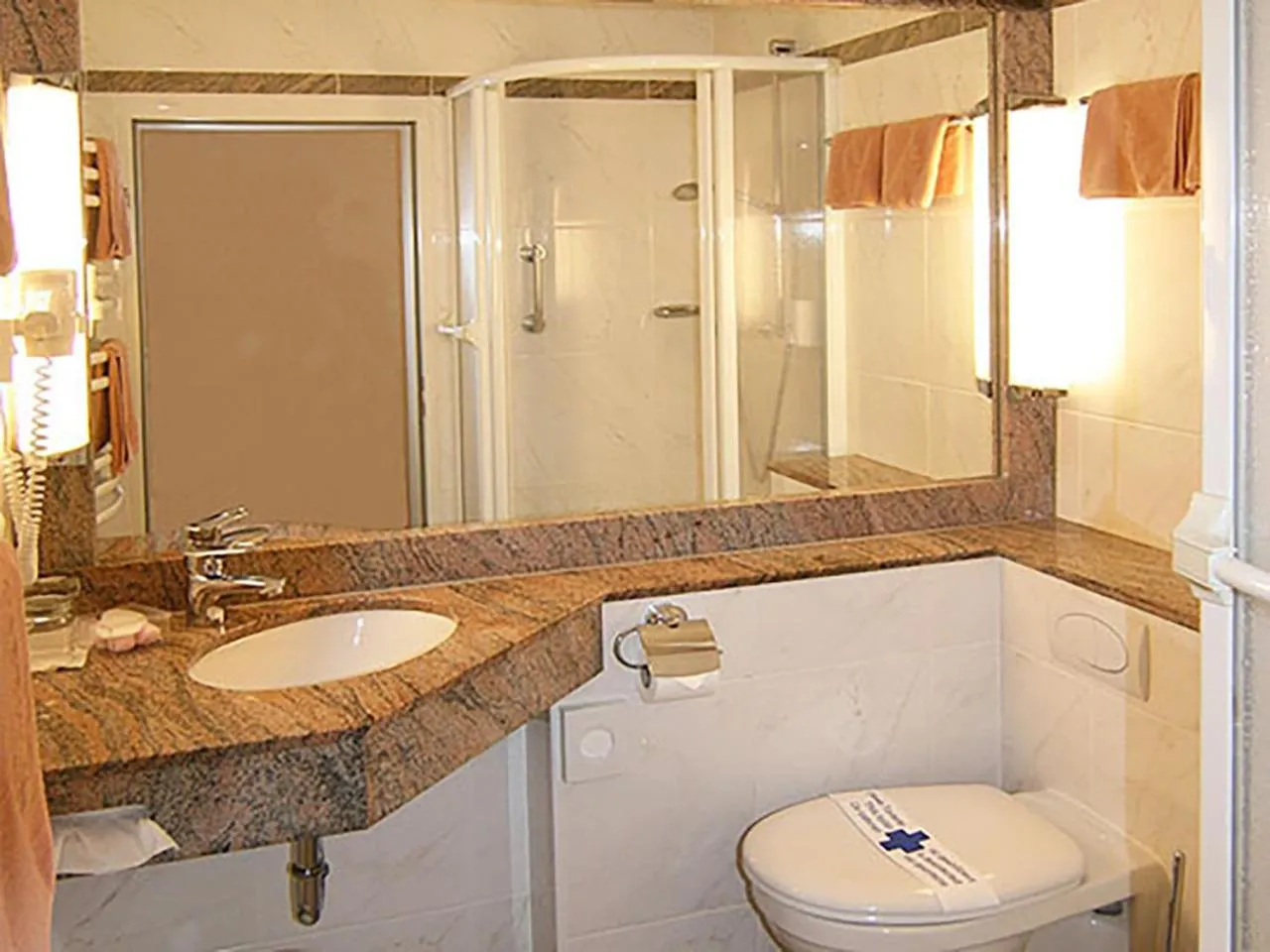 Bathroom in Parkhotel Maasberg GmbH