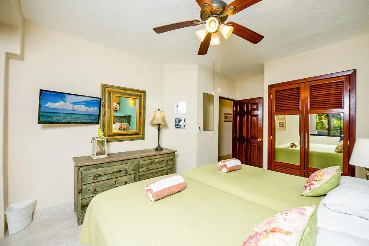 Bed in Xaman Ha Beach Front Condo