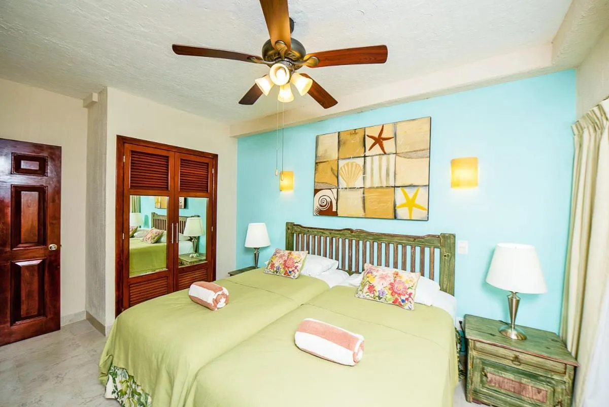 Bed in Xaman Ha Beach Front Condo