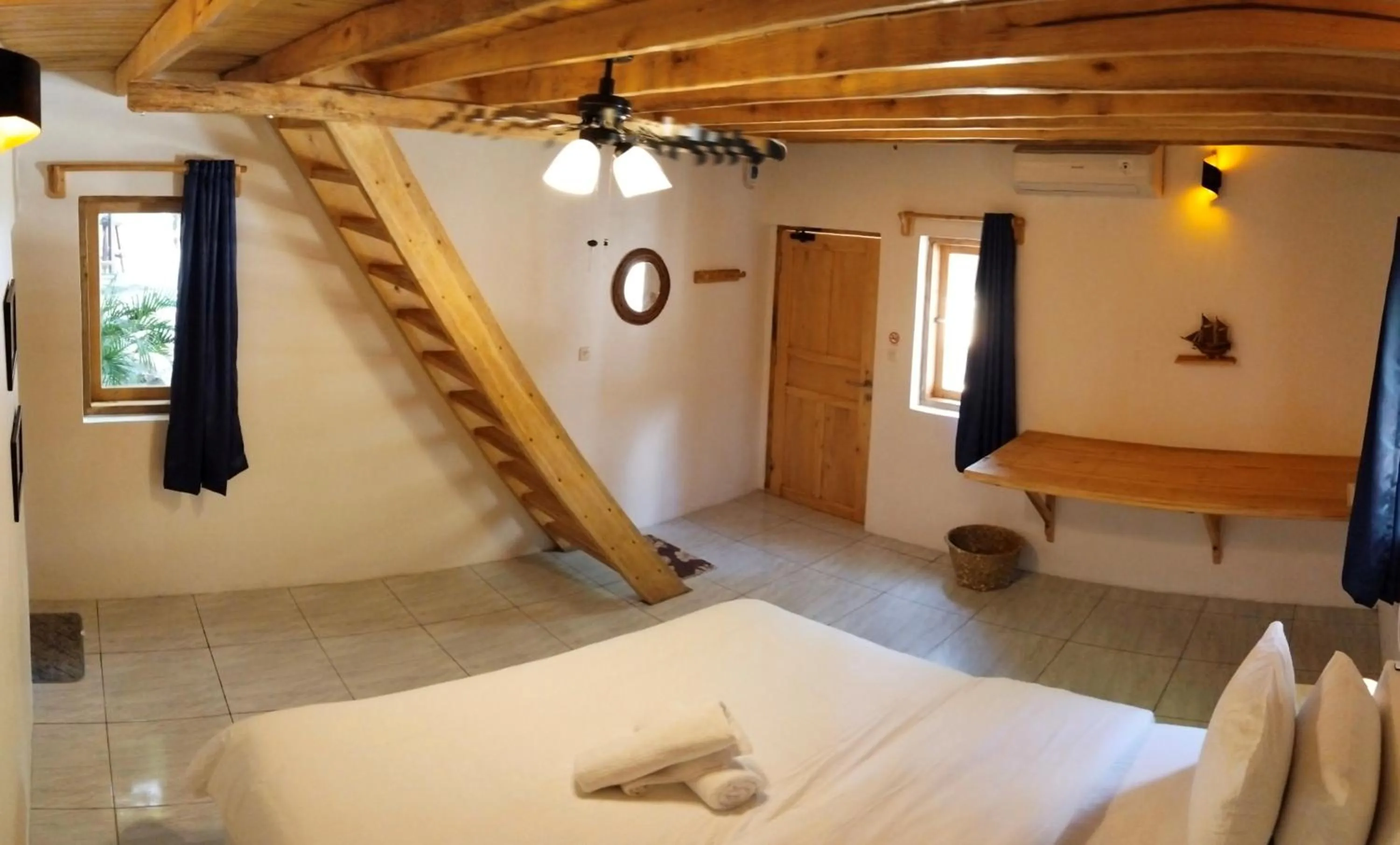 Bed in Blue Planet Dive Resort