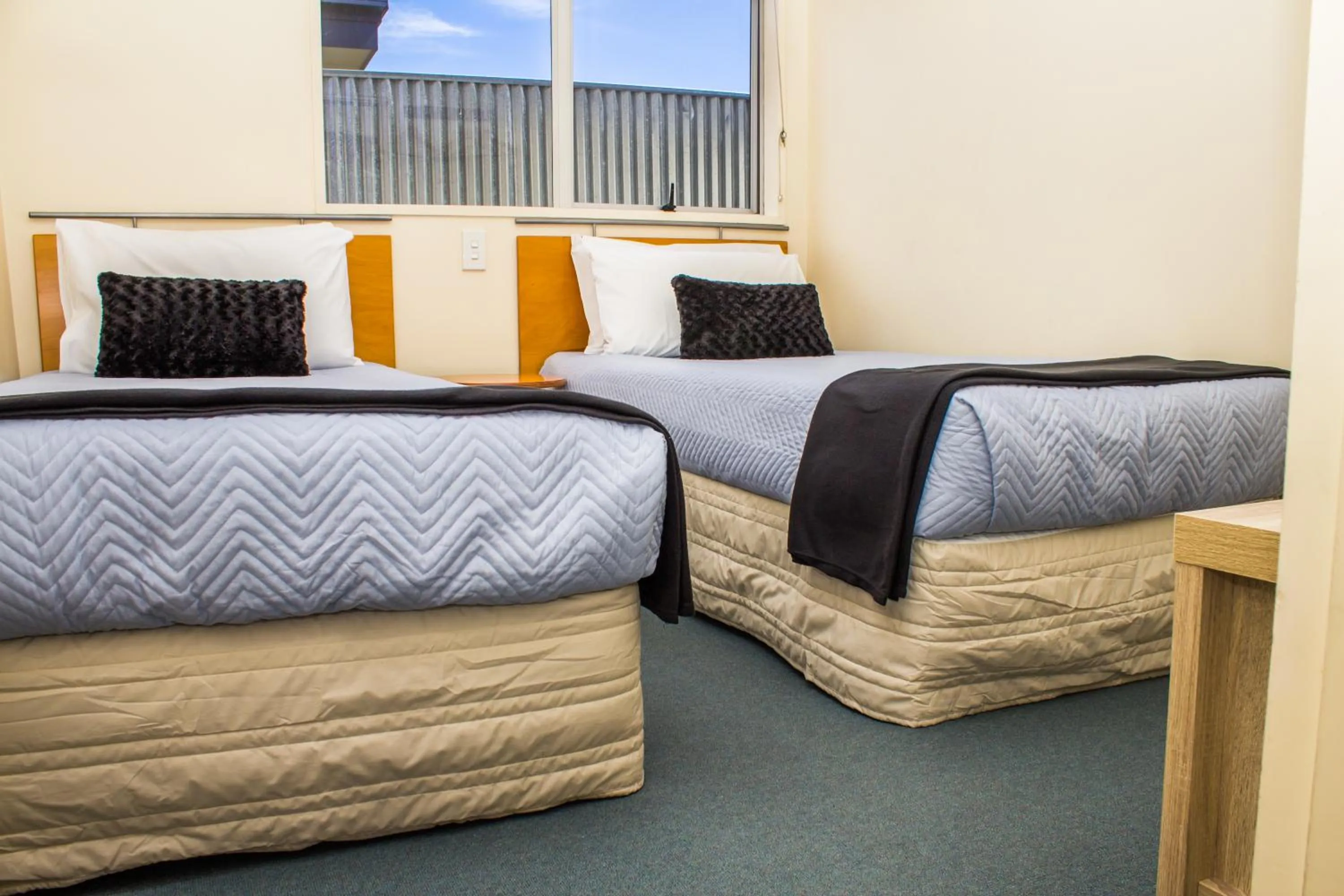 Bed in Bella Tuscany Motor Lodge