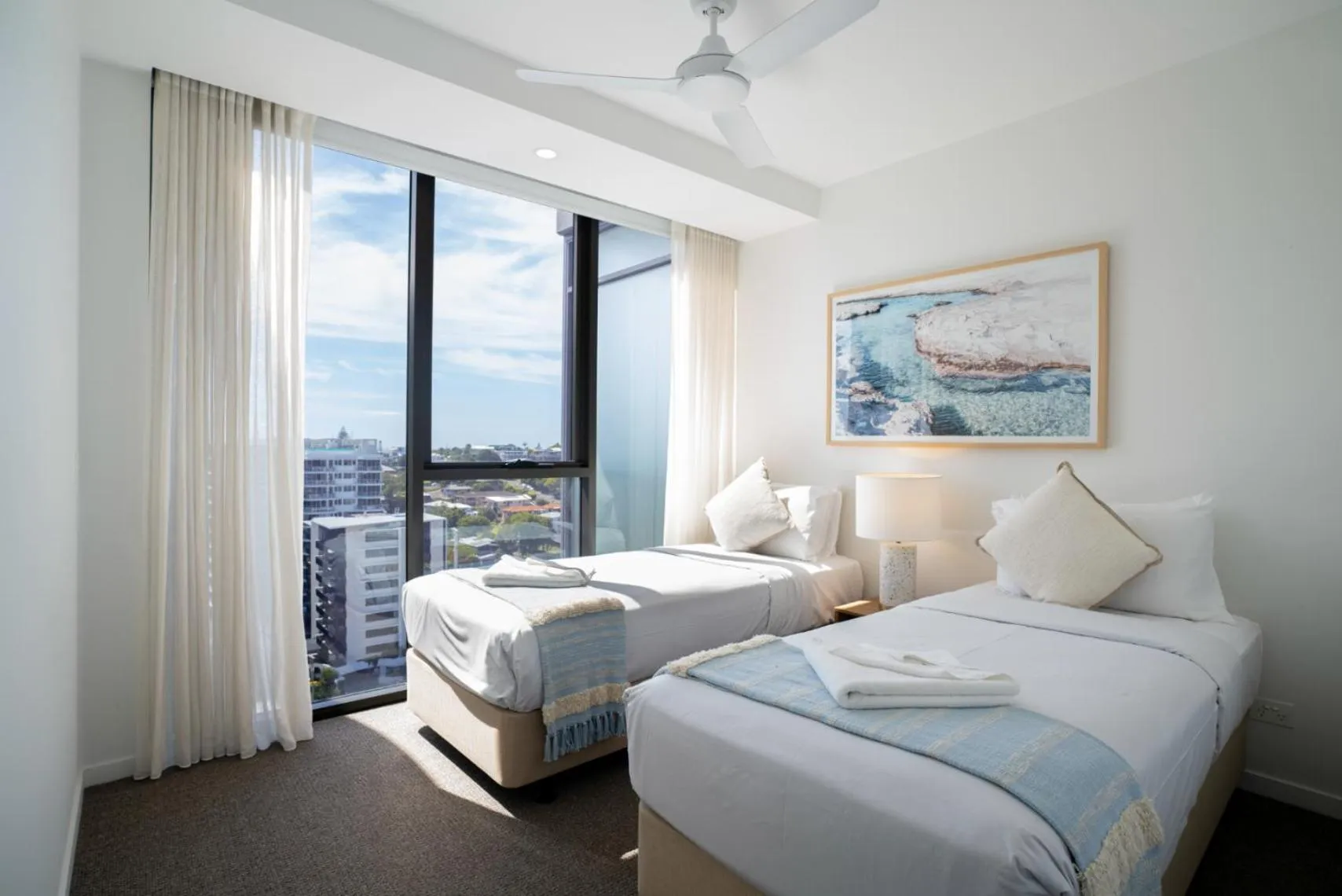 Bed in X Kirra Apartments