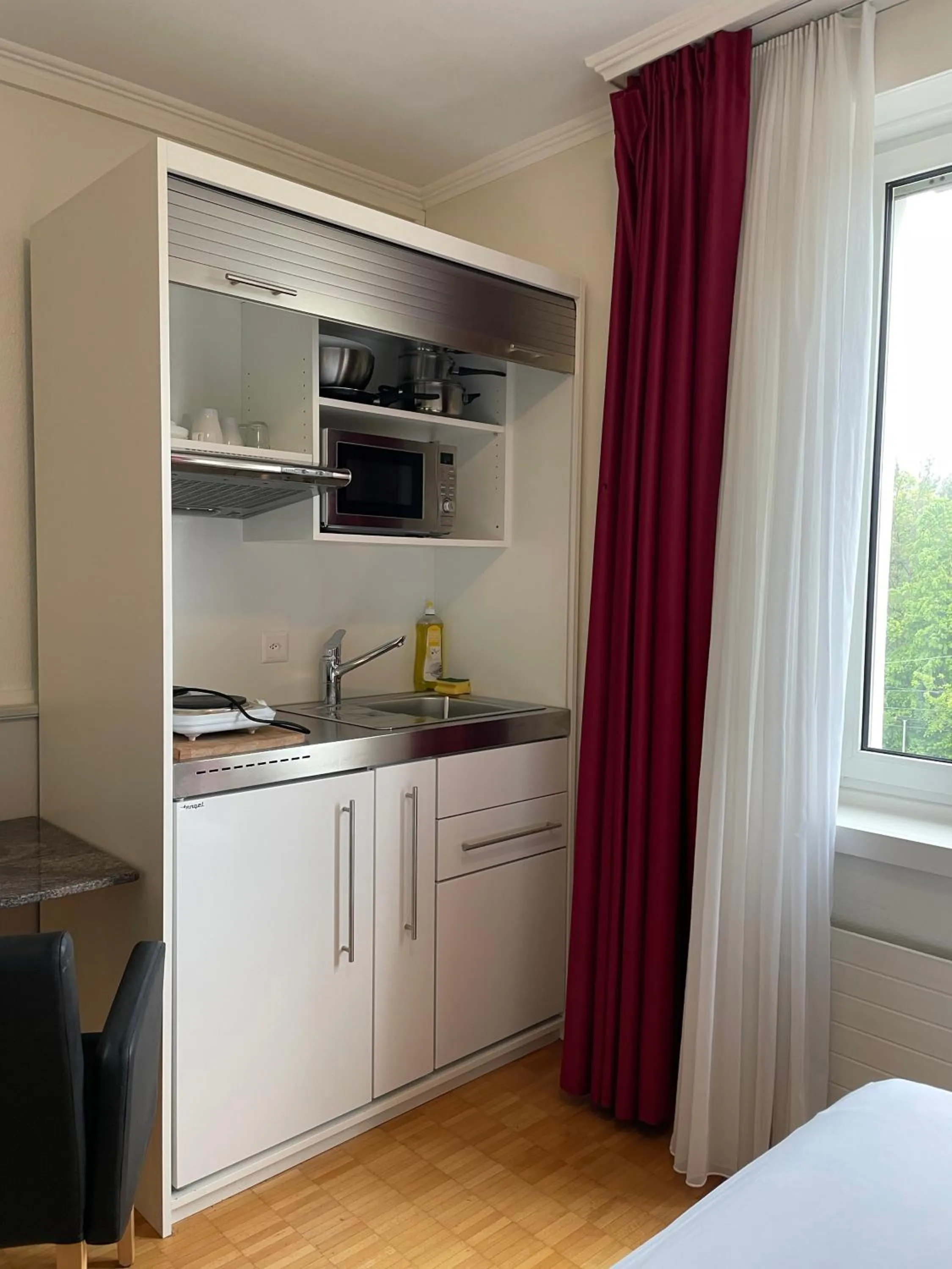 Kitchen or kitchenette in Swiss Star Irchel - Self Check-In