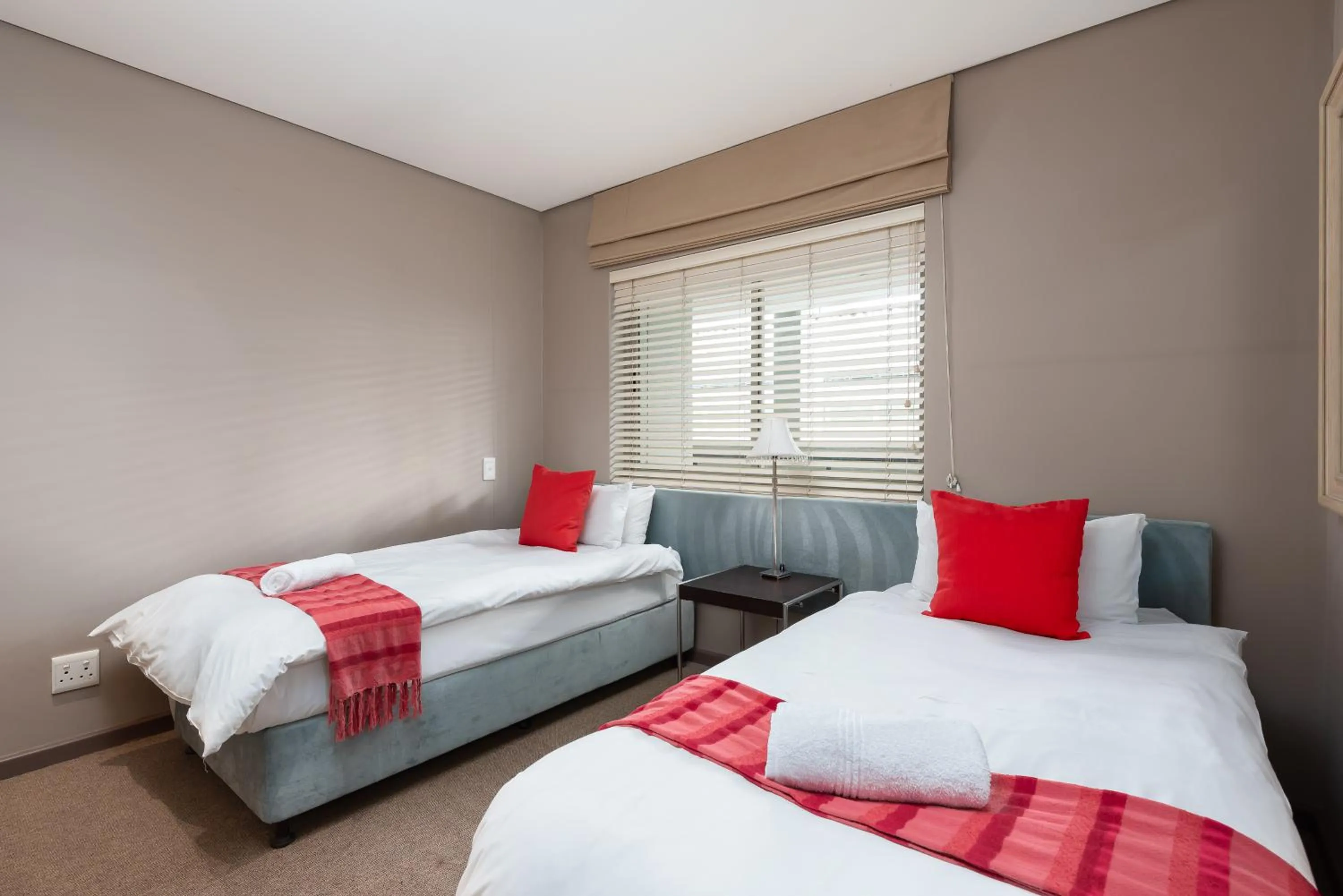 Bed in HarbourEdge Suites by Totalstay