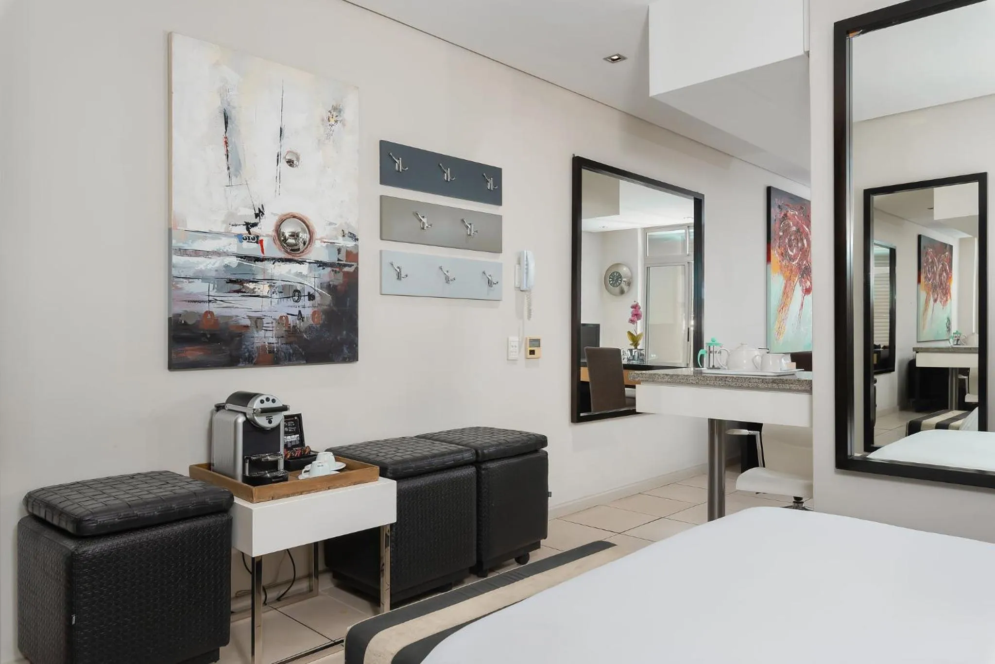 Living room, Bed in HarbourEdge Suites by Totalstay