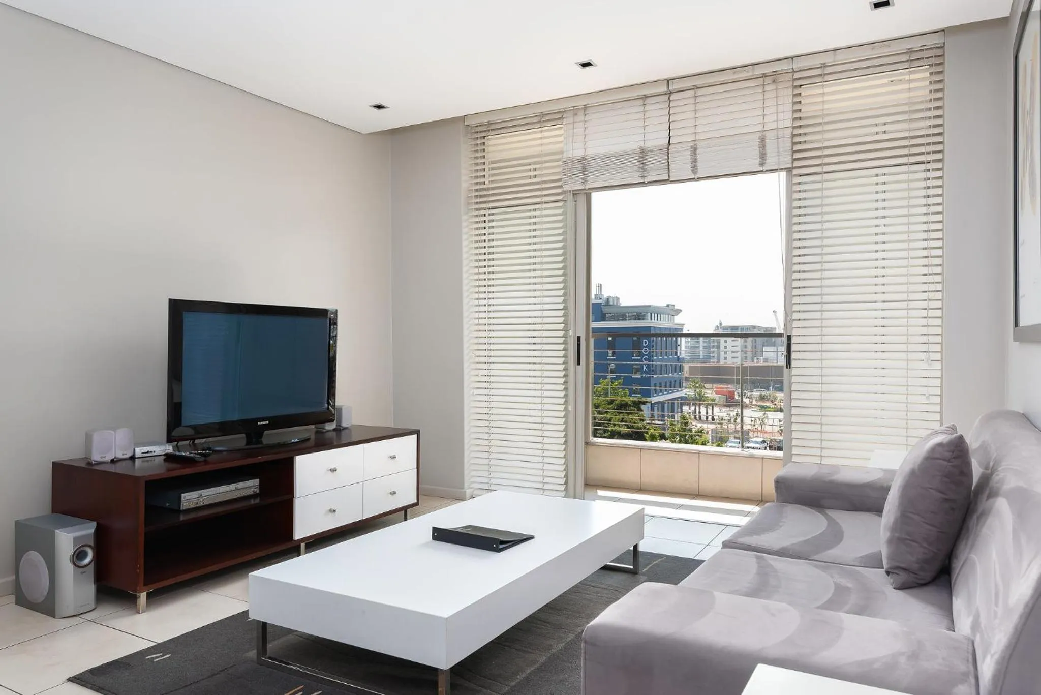 TV and multimedia, Seating Area in HarbourEdge Suites by Totalstay