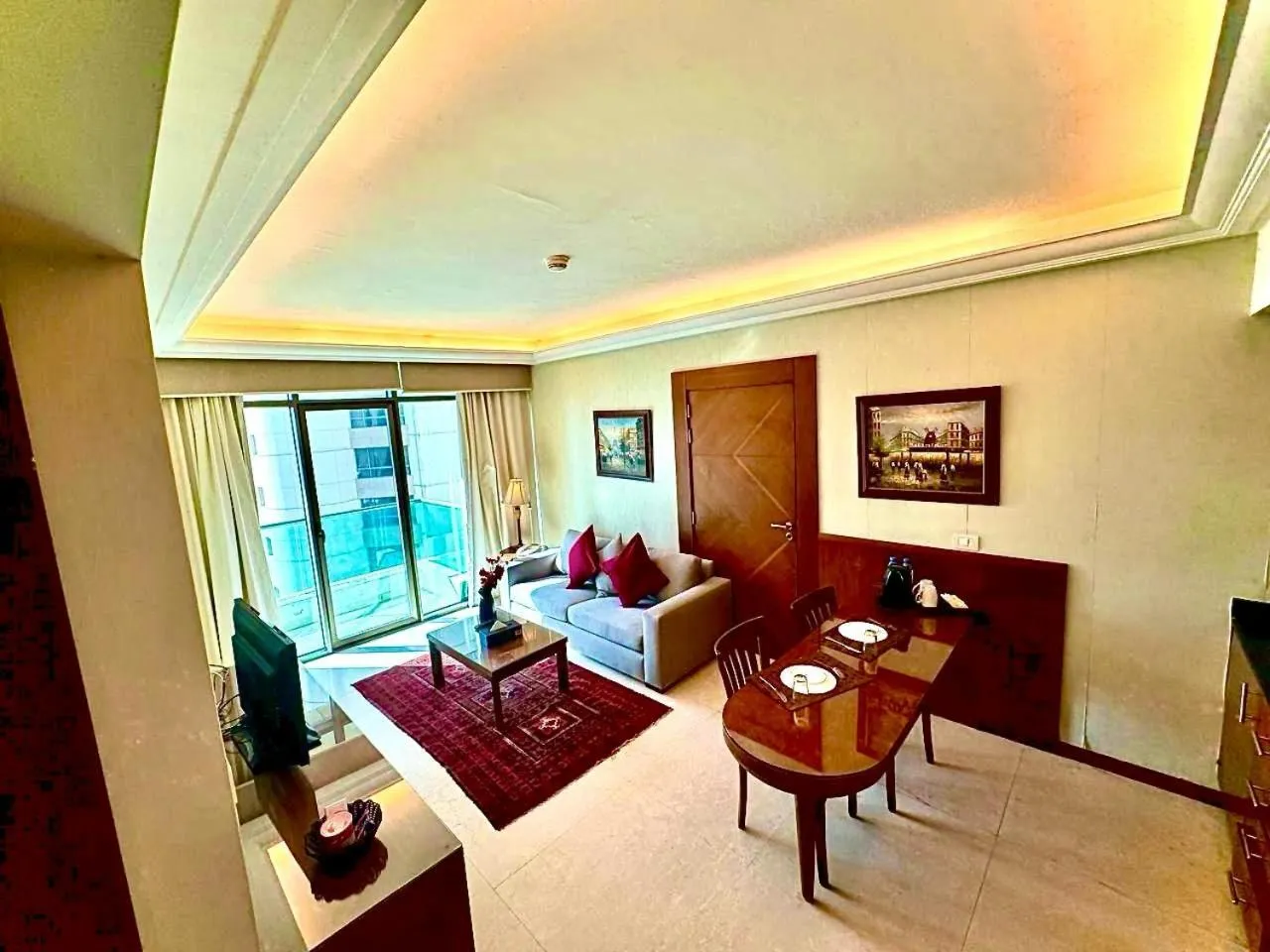 Living room, Bed in King Suites Hotel