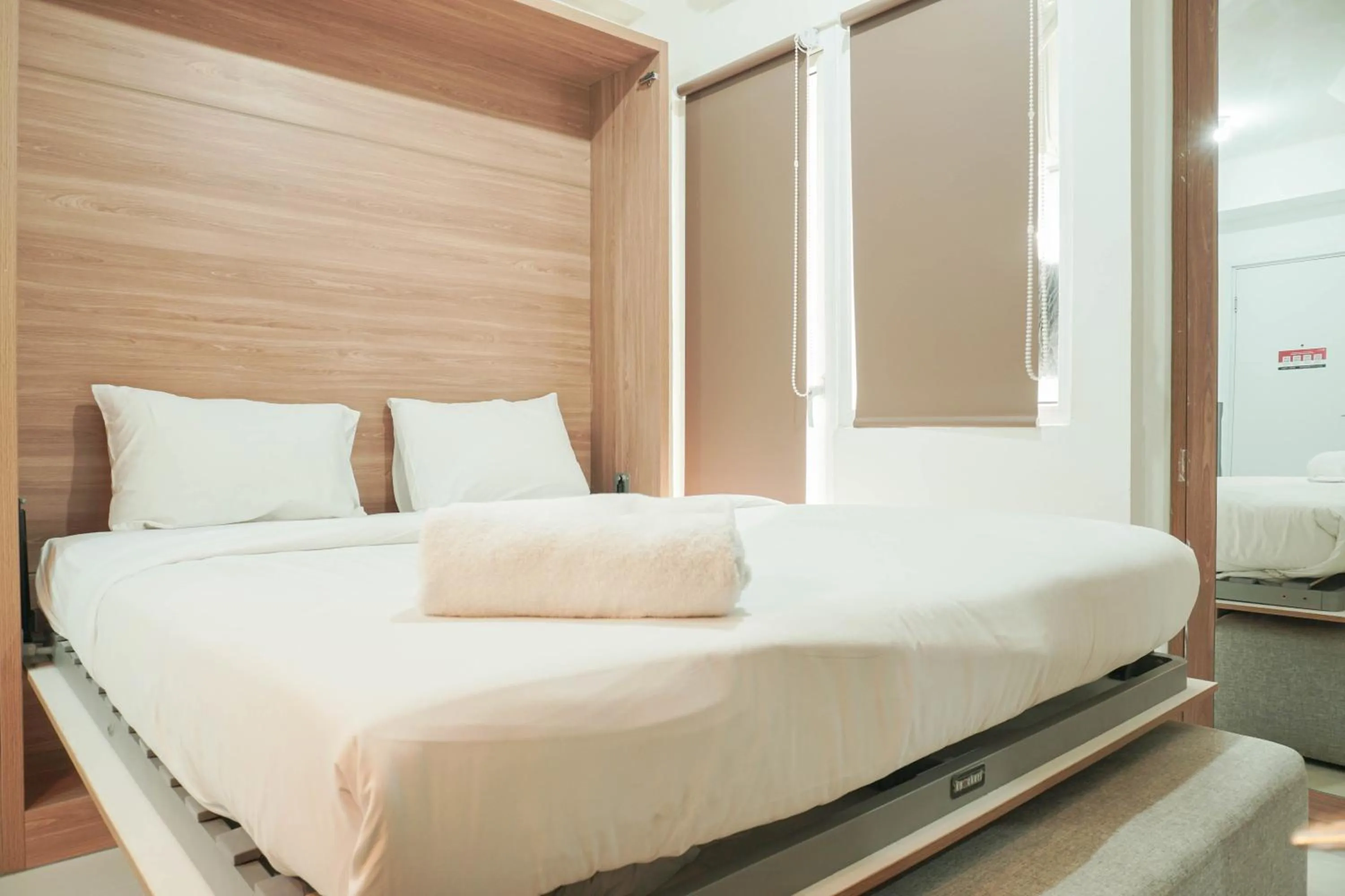 Bedroom, Bed in Lovely and Strategic Studio at Green Pramuka Apartment By Travelio