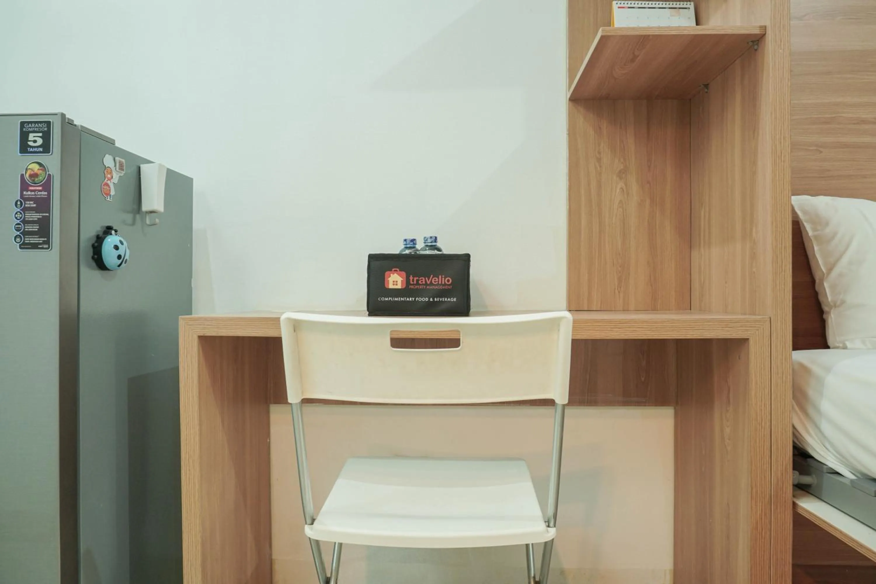 Bed in Lovely and Strategic Studio at Green Pramuka Apartment By Travelio