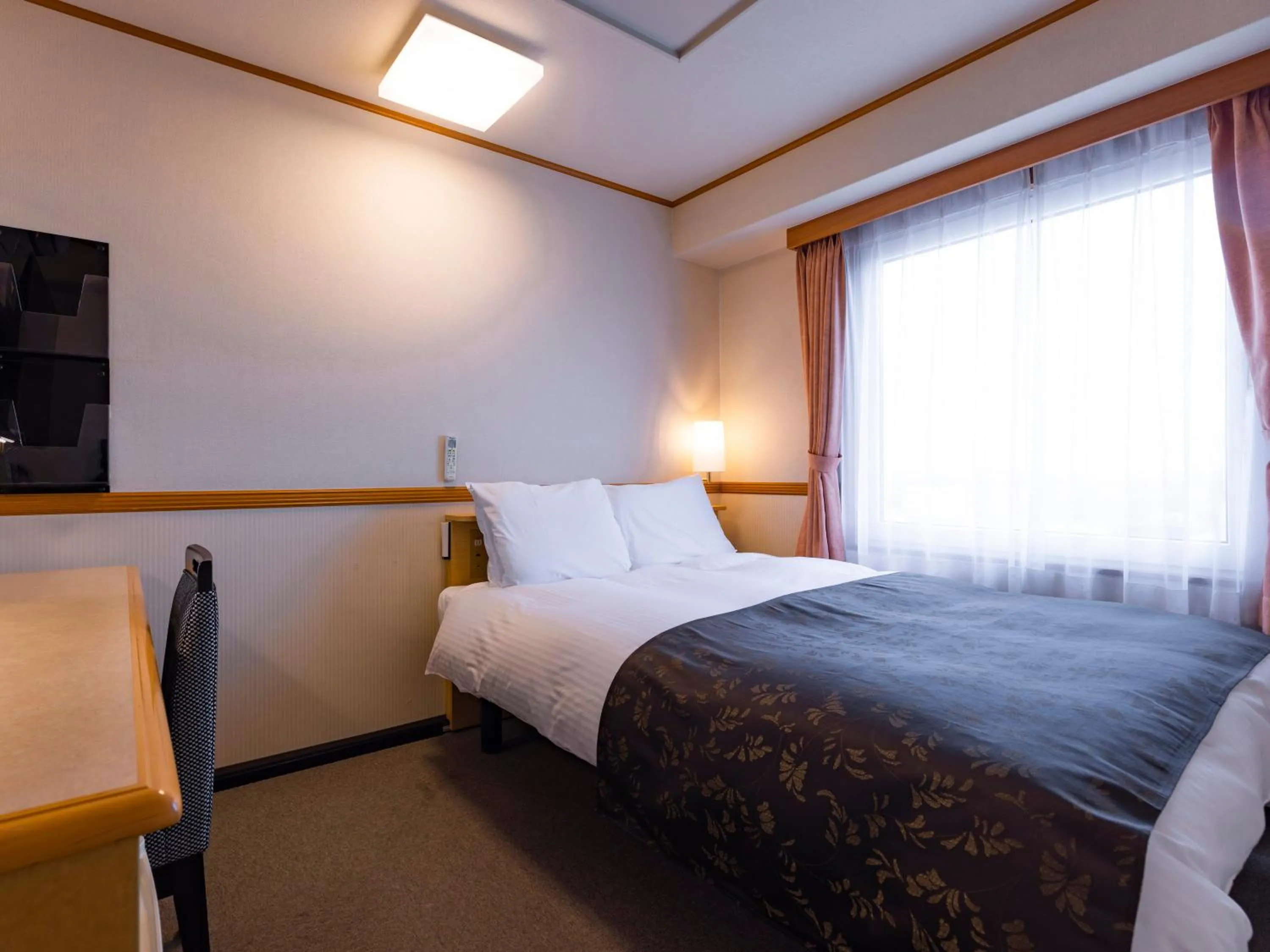 Photo of the whole room, Bed in APA Hotel Miyagi Furukawa Ekimae