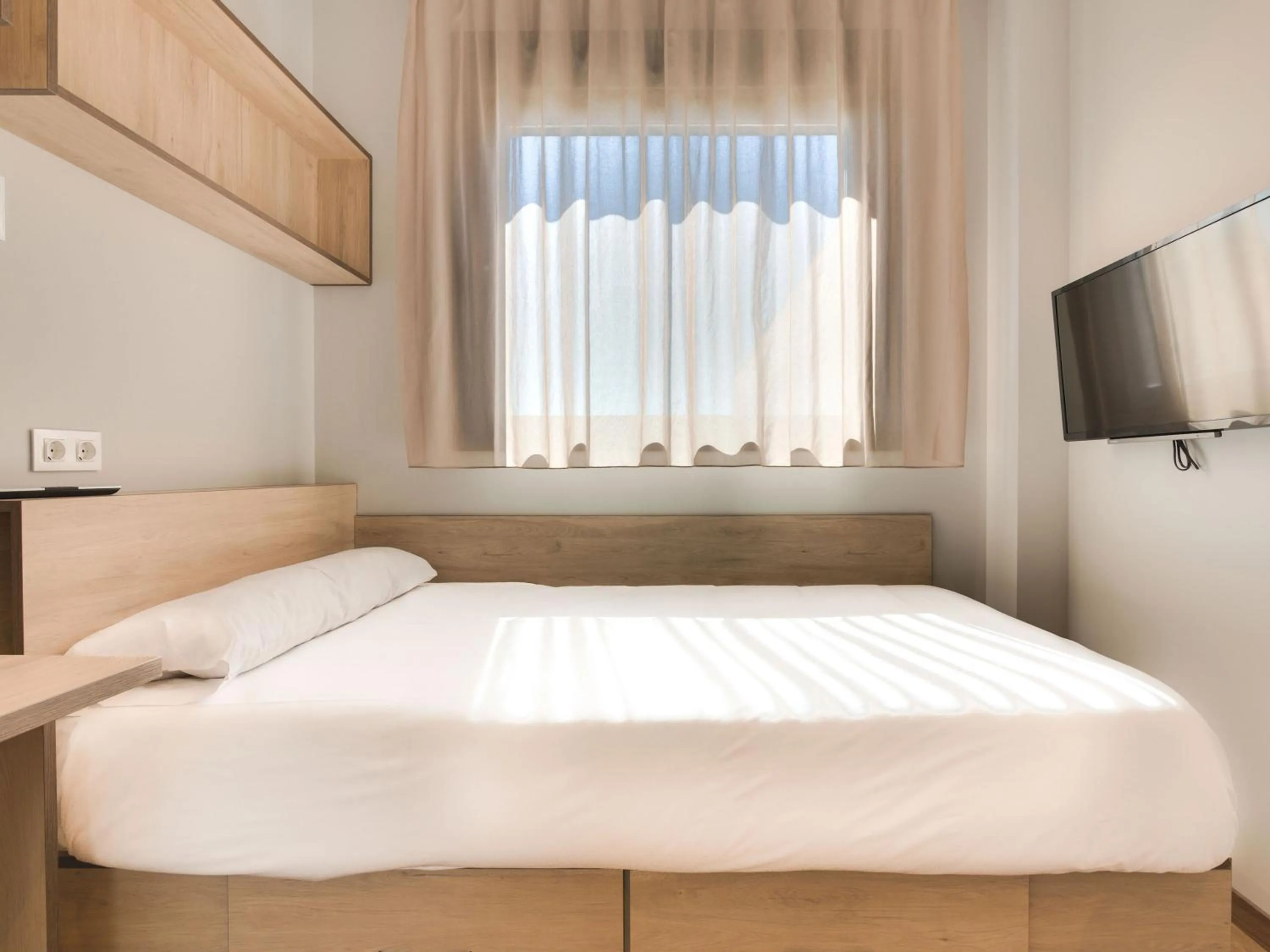 Bed in Livensa Living Studios Málaga Feria