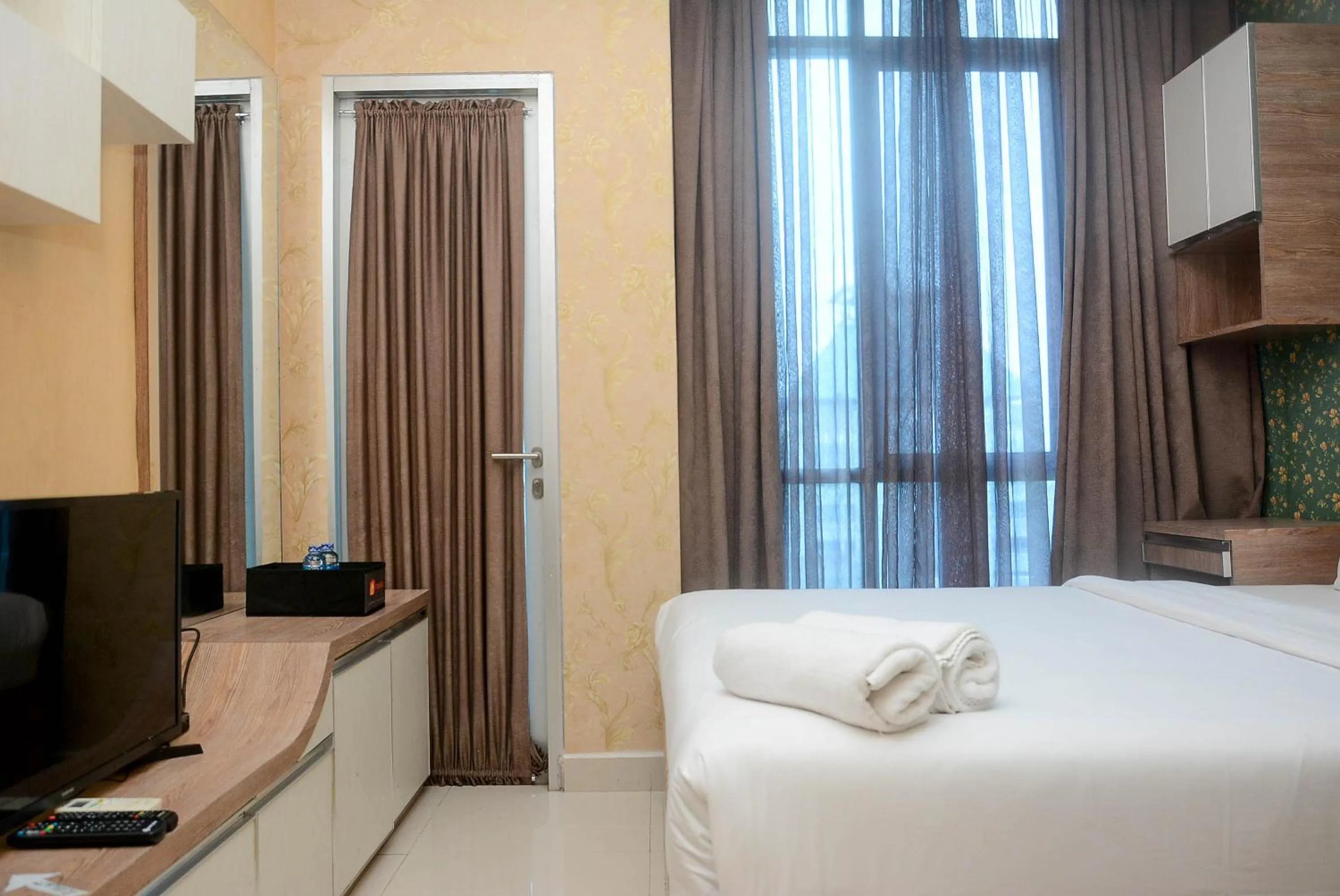 Bed in Gorgeous and Strategic Studio Apartment at Capitol Park Residence By Travelio