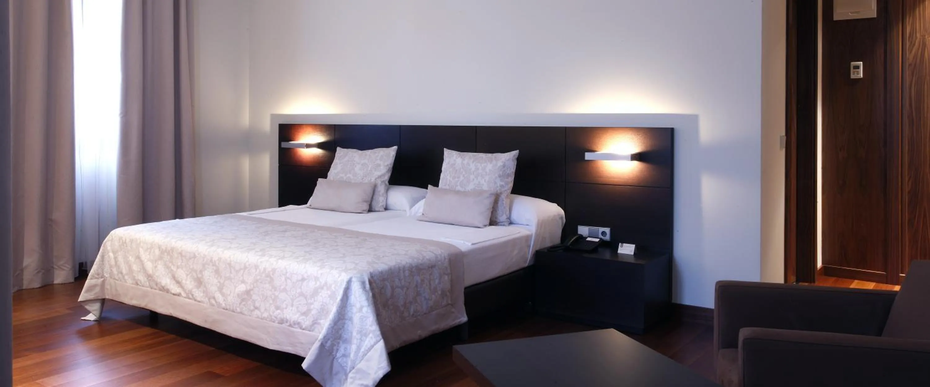 Bed in Hotel Palacio de Merás