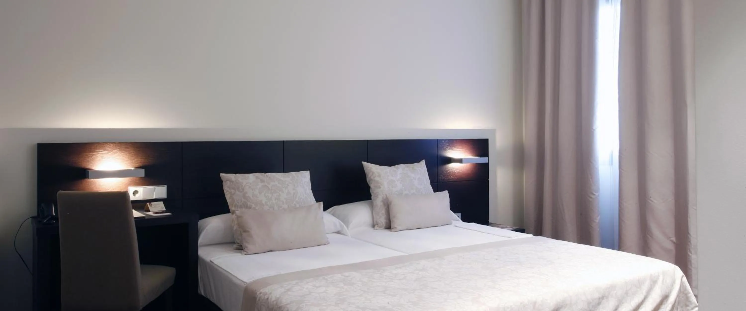 Bed in Hotel Palacio de Merás