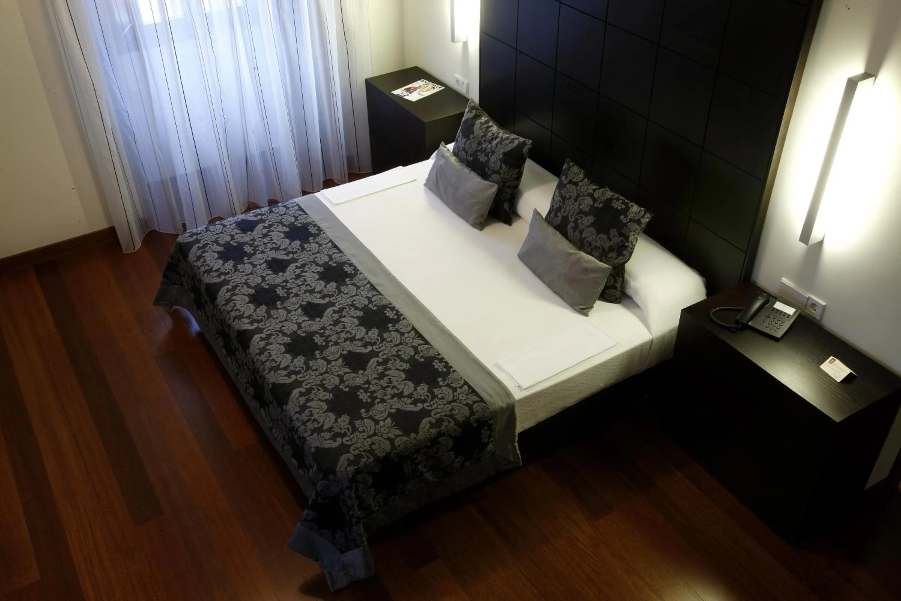 Bed in Hotel Palacio de Merás