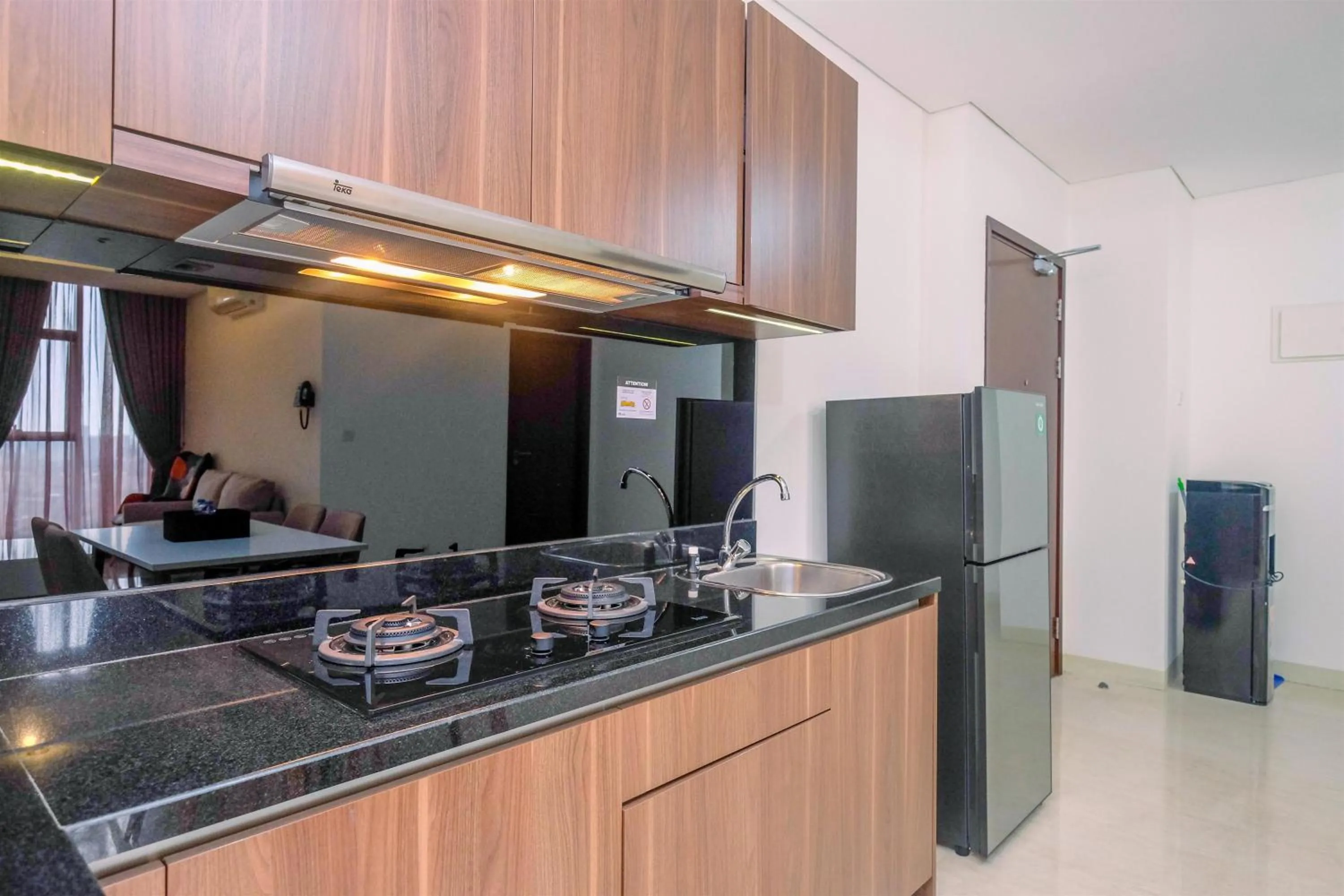 Kitchen or kitchenette in Brand New 2BR L'Avenue Apartment By Travelio
