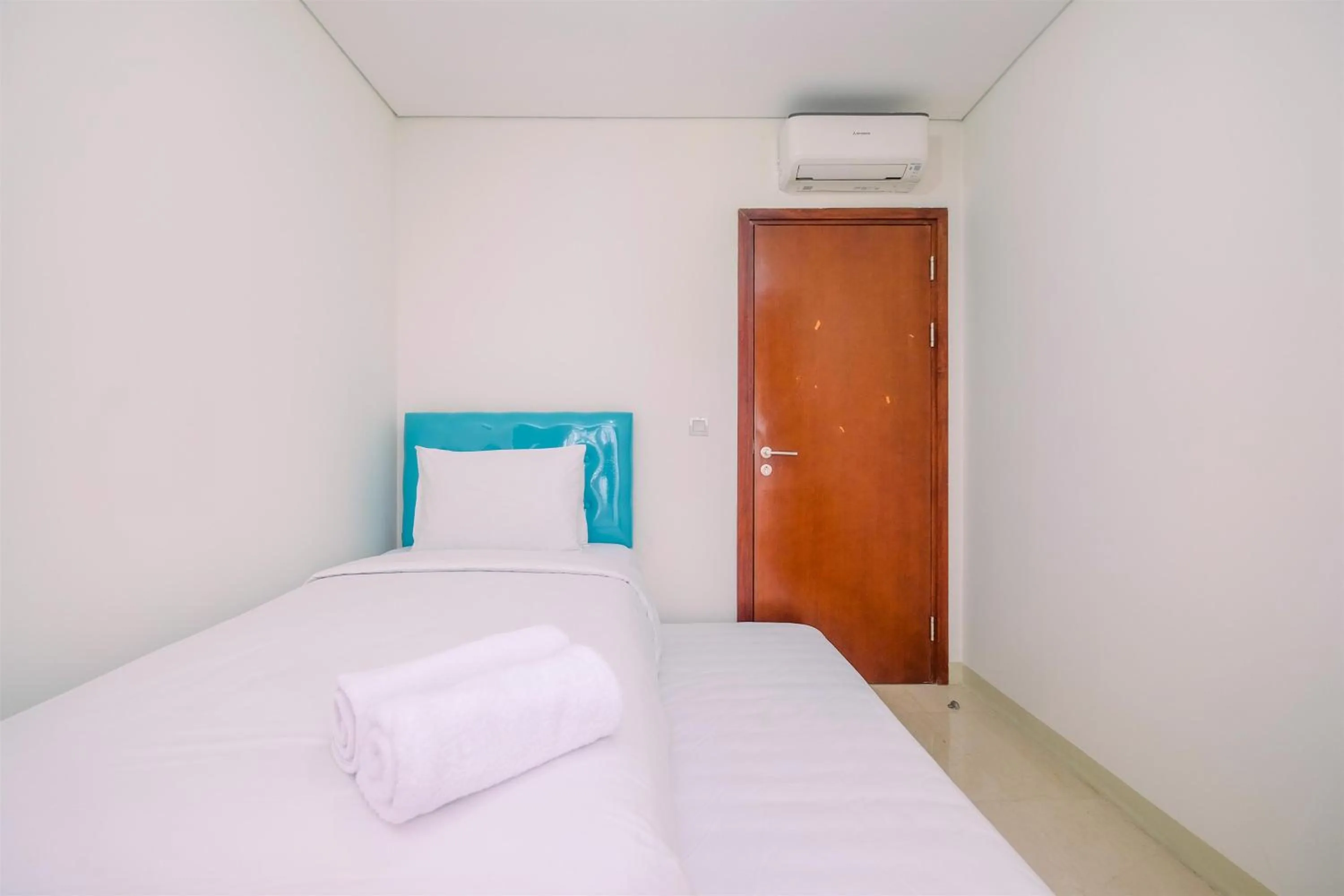 Bedroom in Brand New 2BR L'Avenue Apartment By Travelio