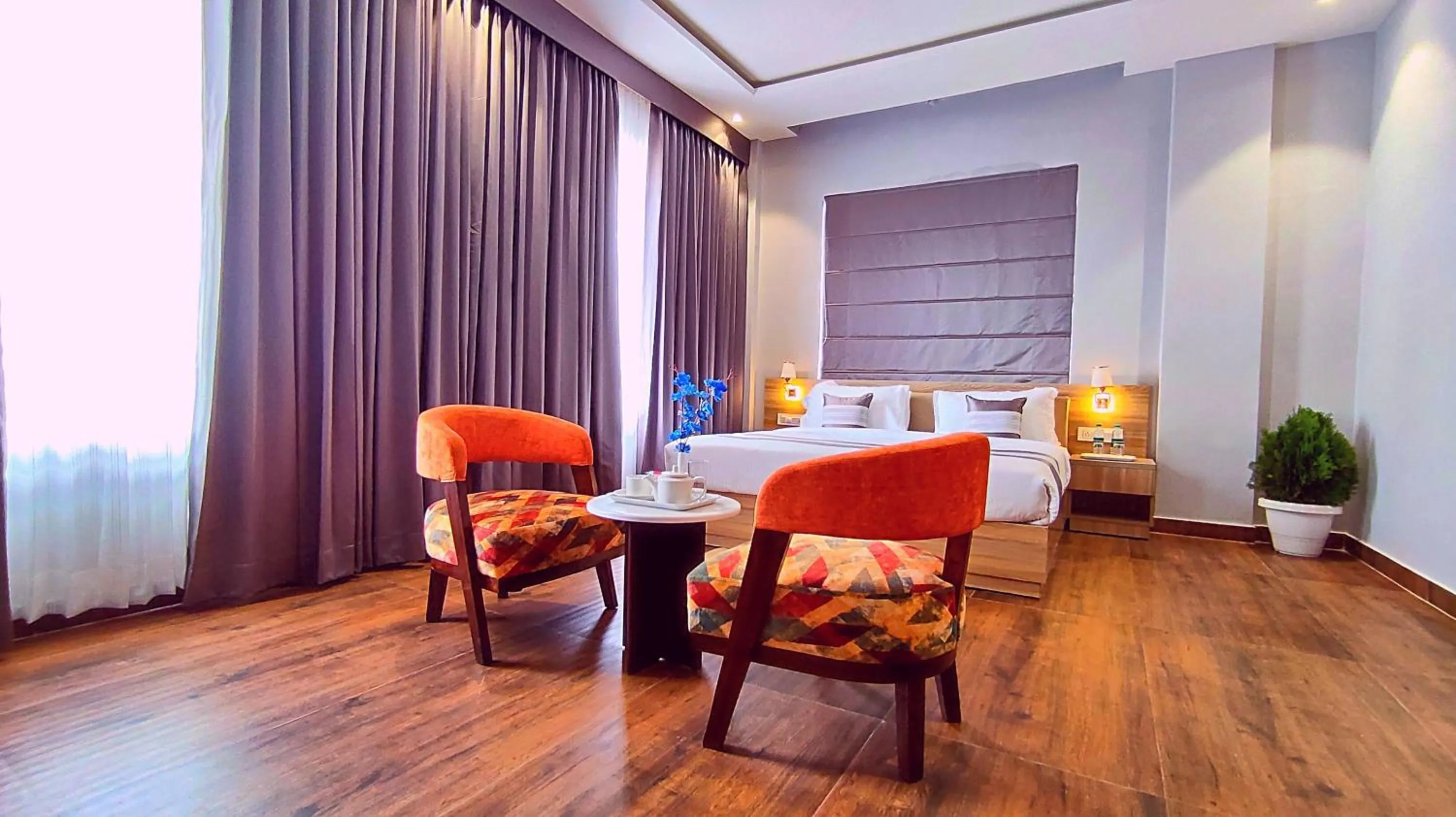 Seating area, Bed in Sshubh Hotel Nathdwara