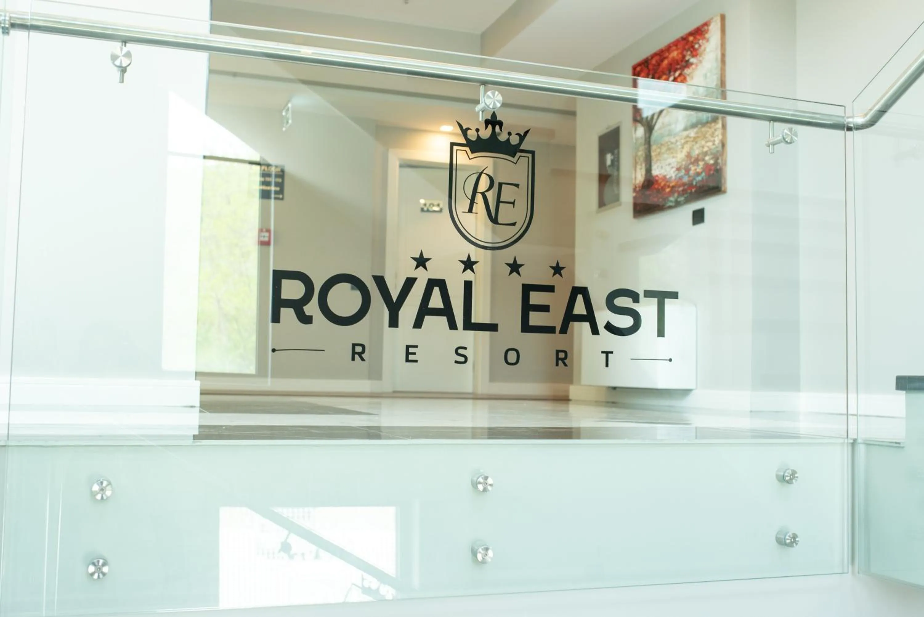 Property logo or sign in Royal East Resort