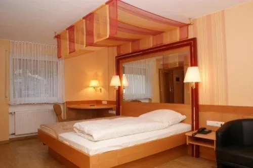Photo of the whole room, Bed in Burg-Hotel