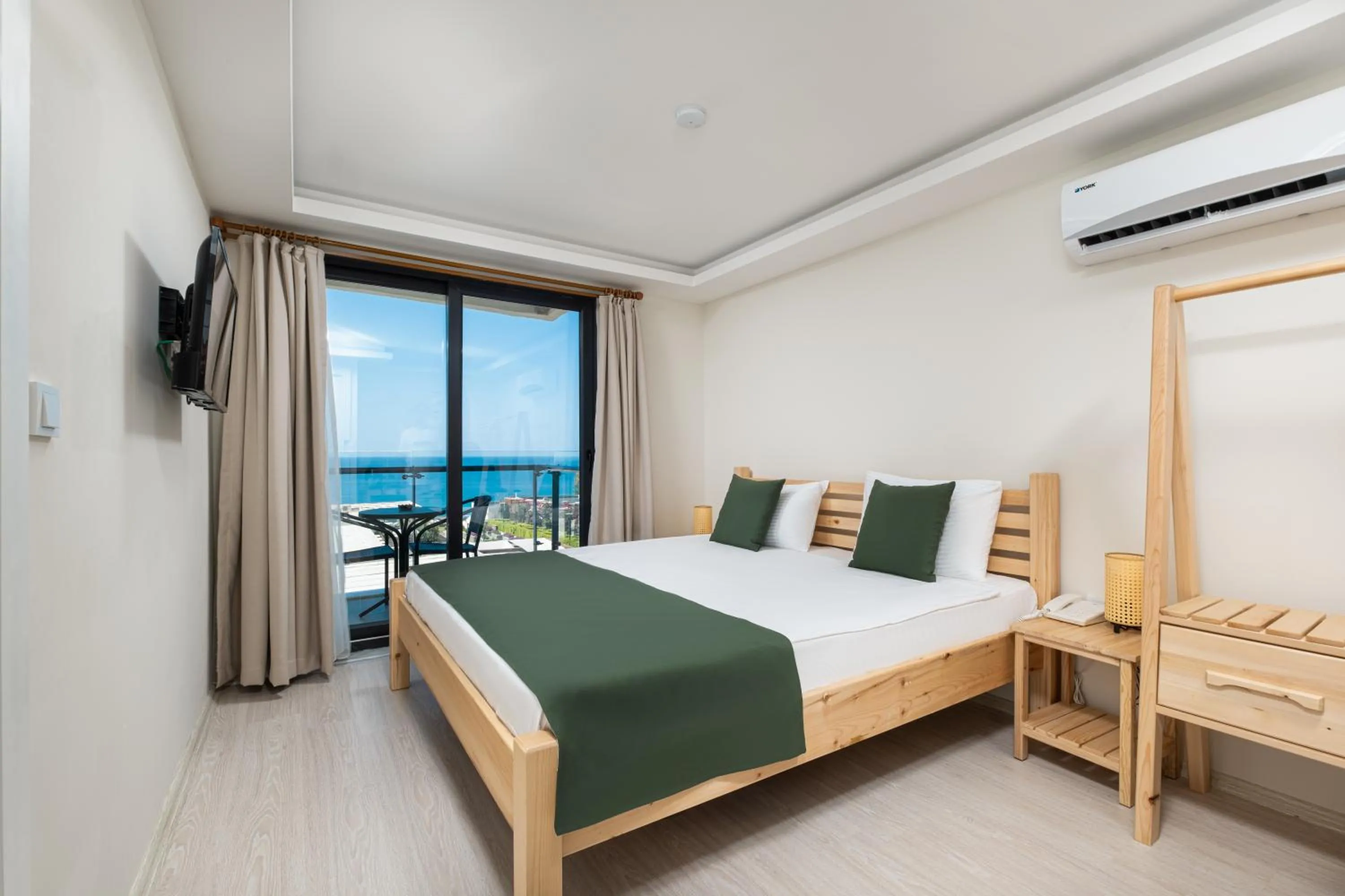 Communal lounge/ TV room, Bed in Feniks Priority Hotel -All Inclusive