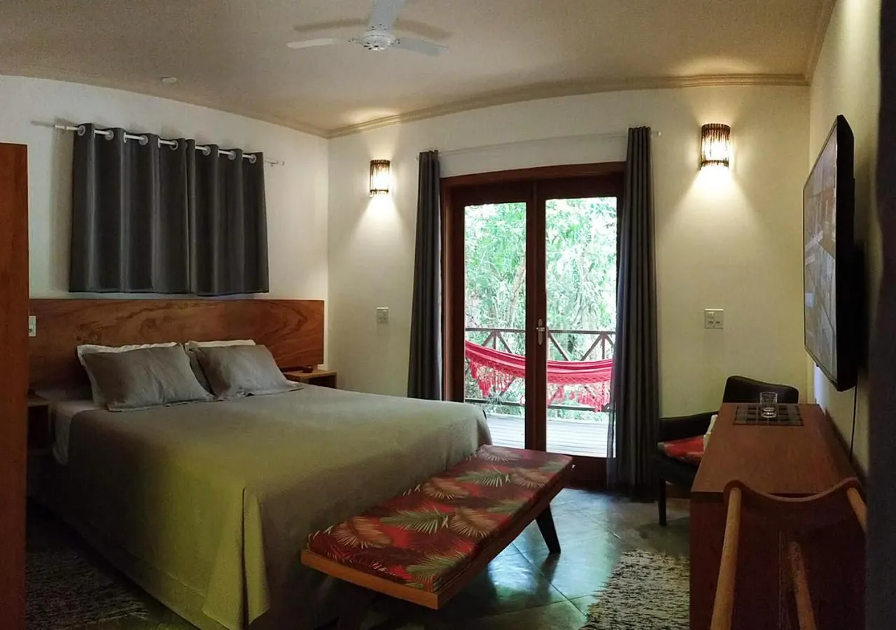 Photo of the whole room, Bed in Pousada Vila Araticum