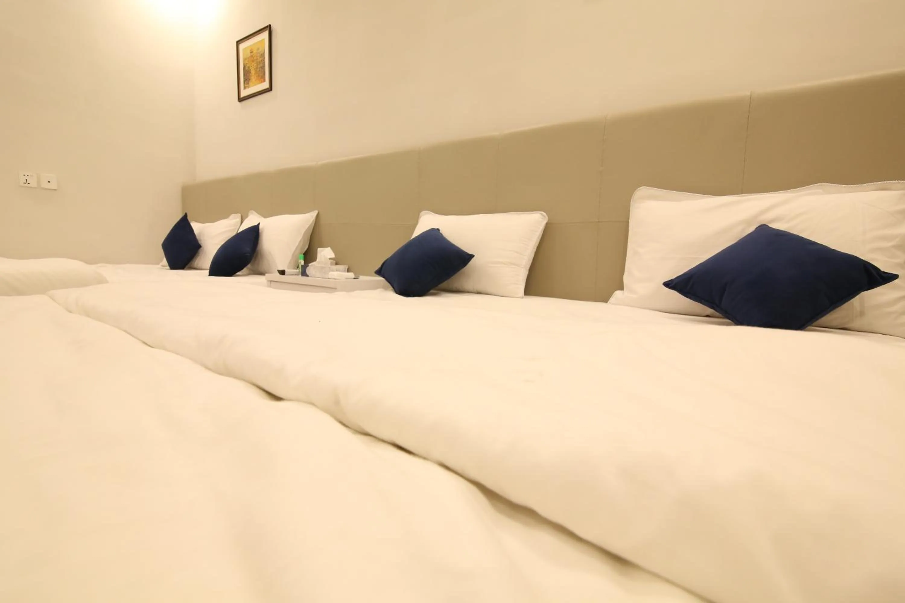 Bed in Cuzzy Inn Hotel