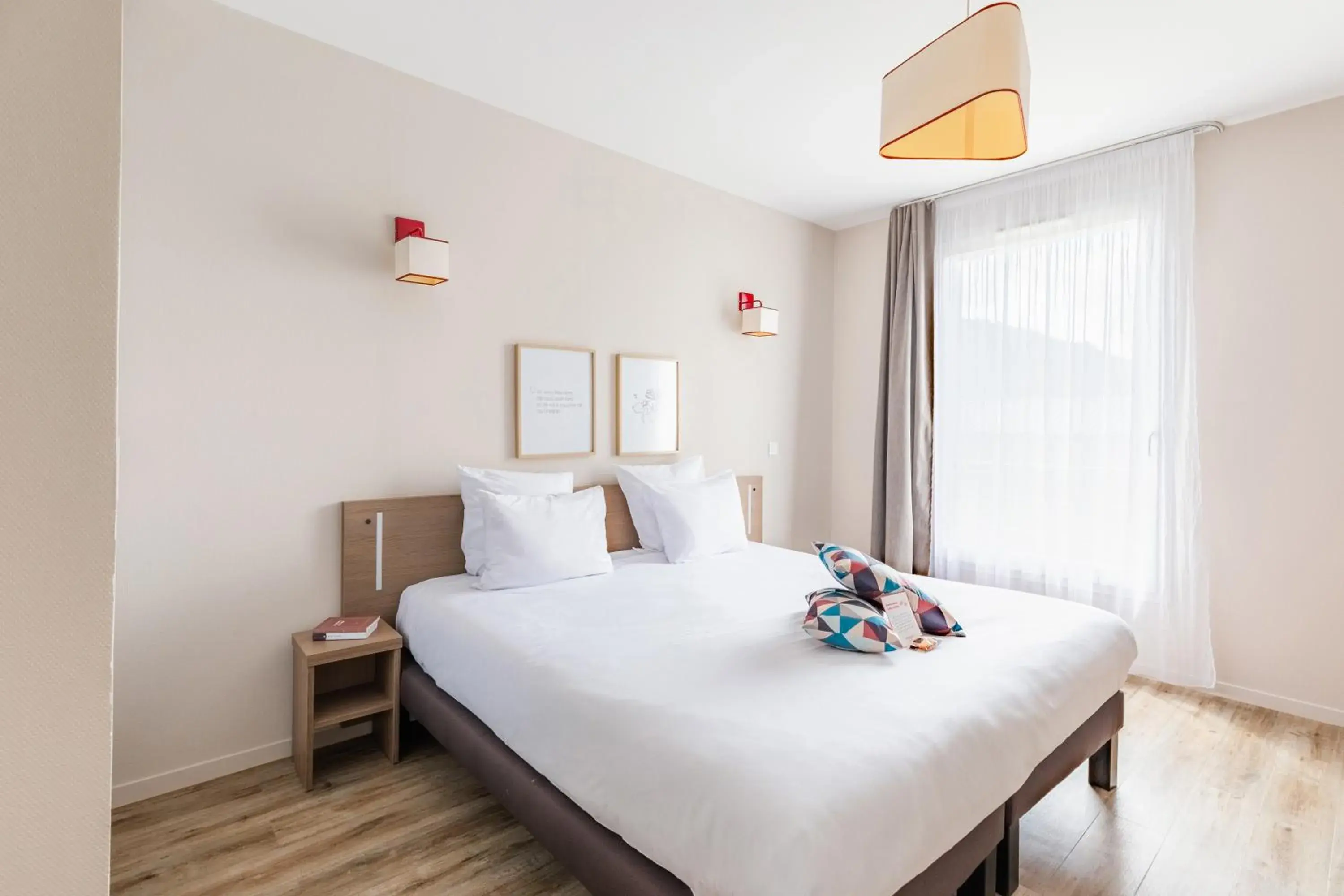 Bed in Appart'City Confort Cherbourg Bed in Appart'City Confort Cherbourg