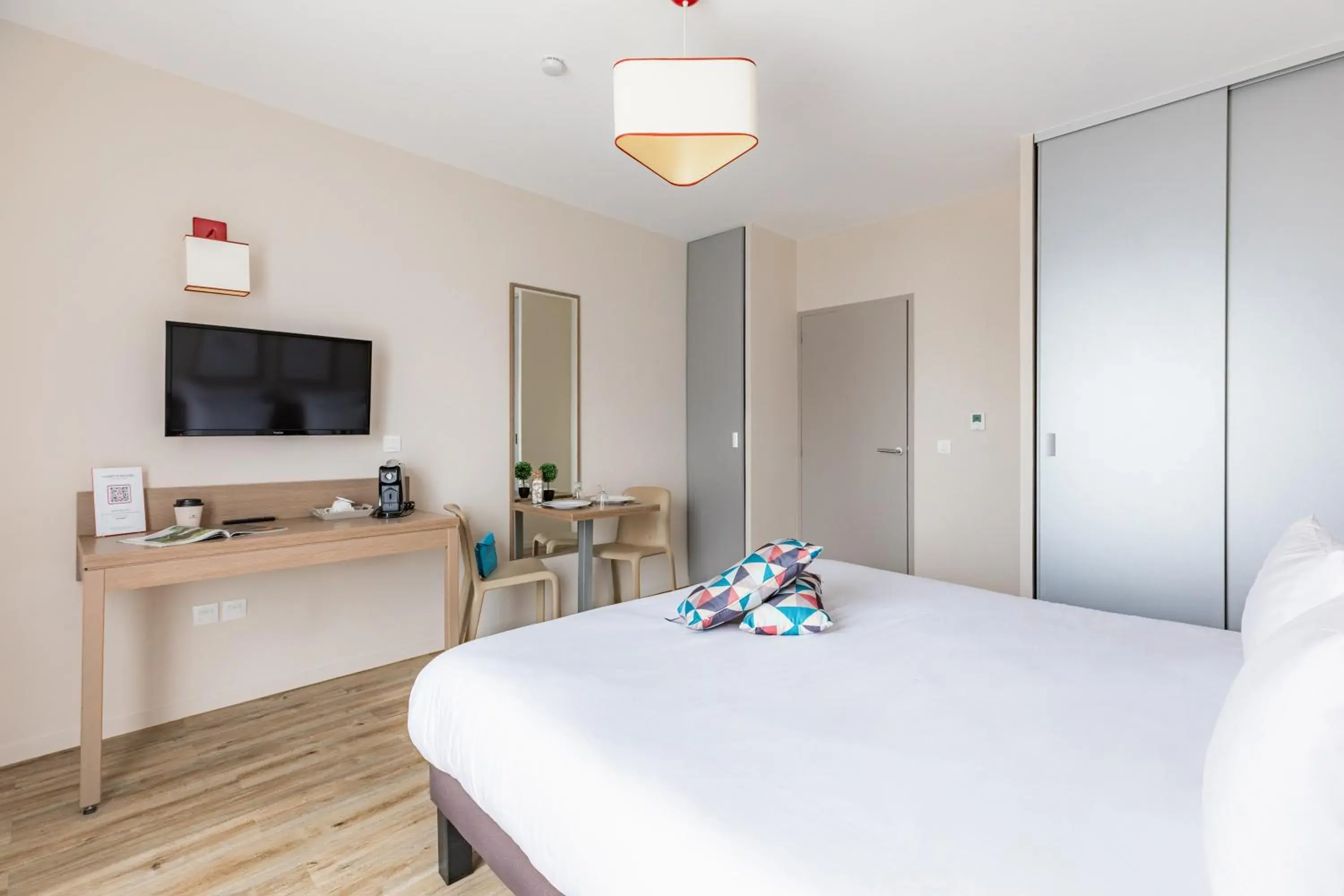 Bed in Appart'City Confort Cherbourg Bed in Appart'City Confort Cherbourg