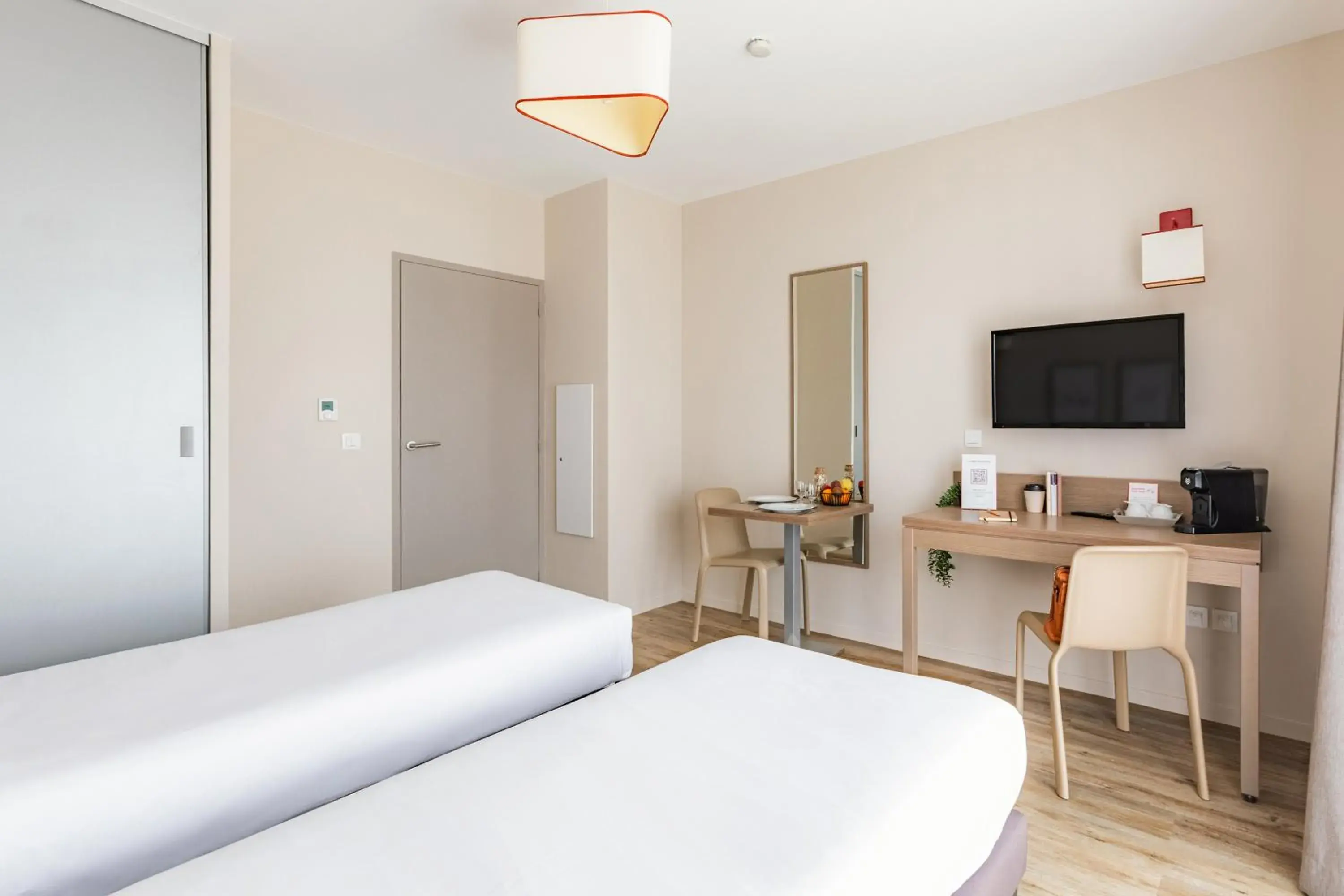 Bed in Appart'City Confort Cherbourg Bed in Appart'City Confort Cherbourg