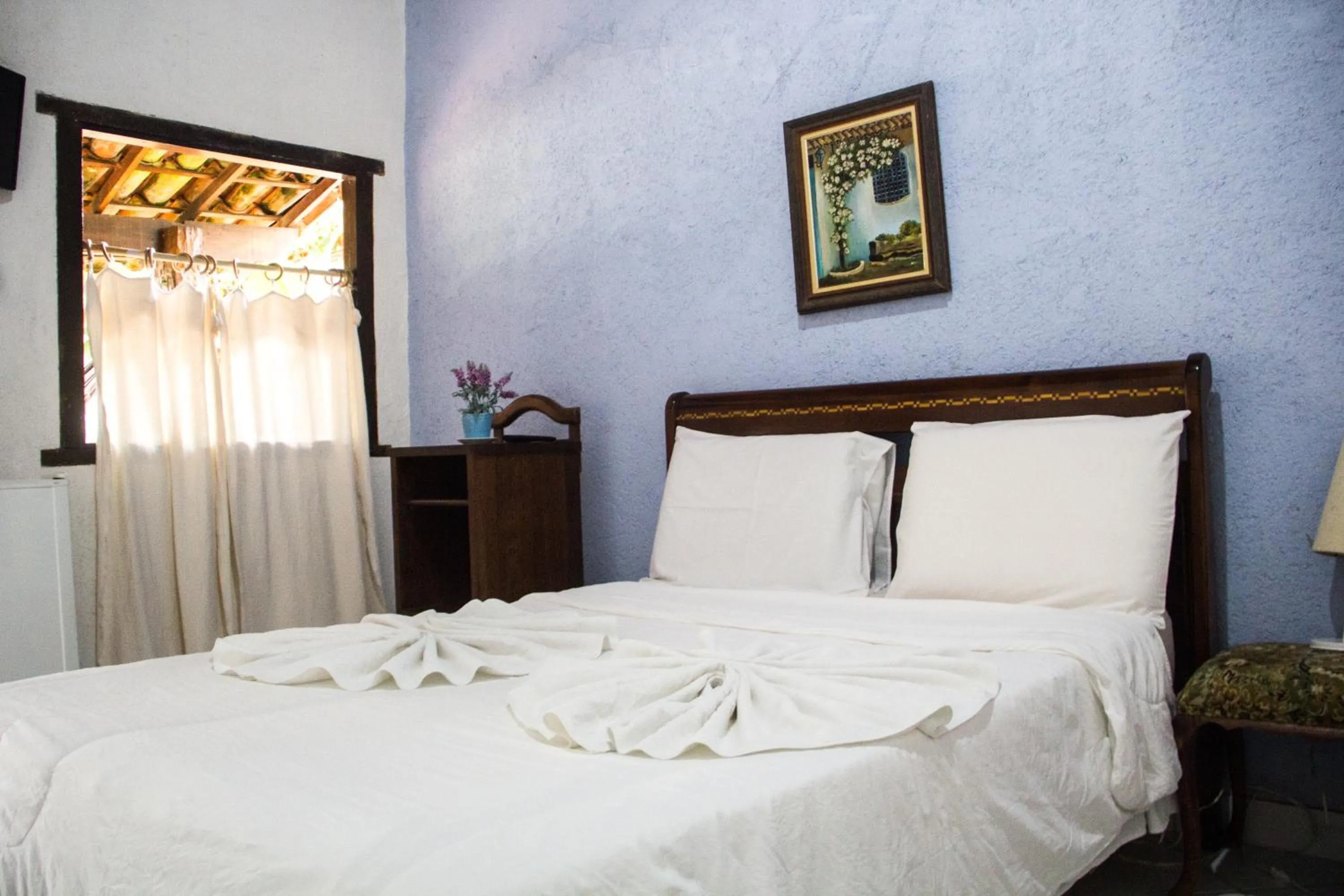 Bed in Pousada Adega Cipo