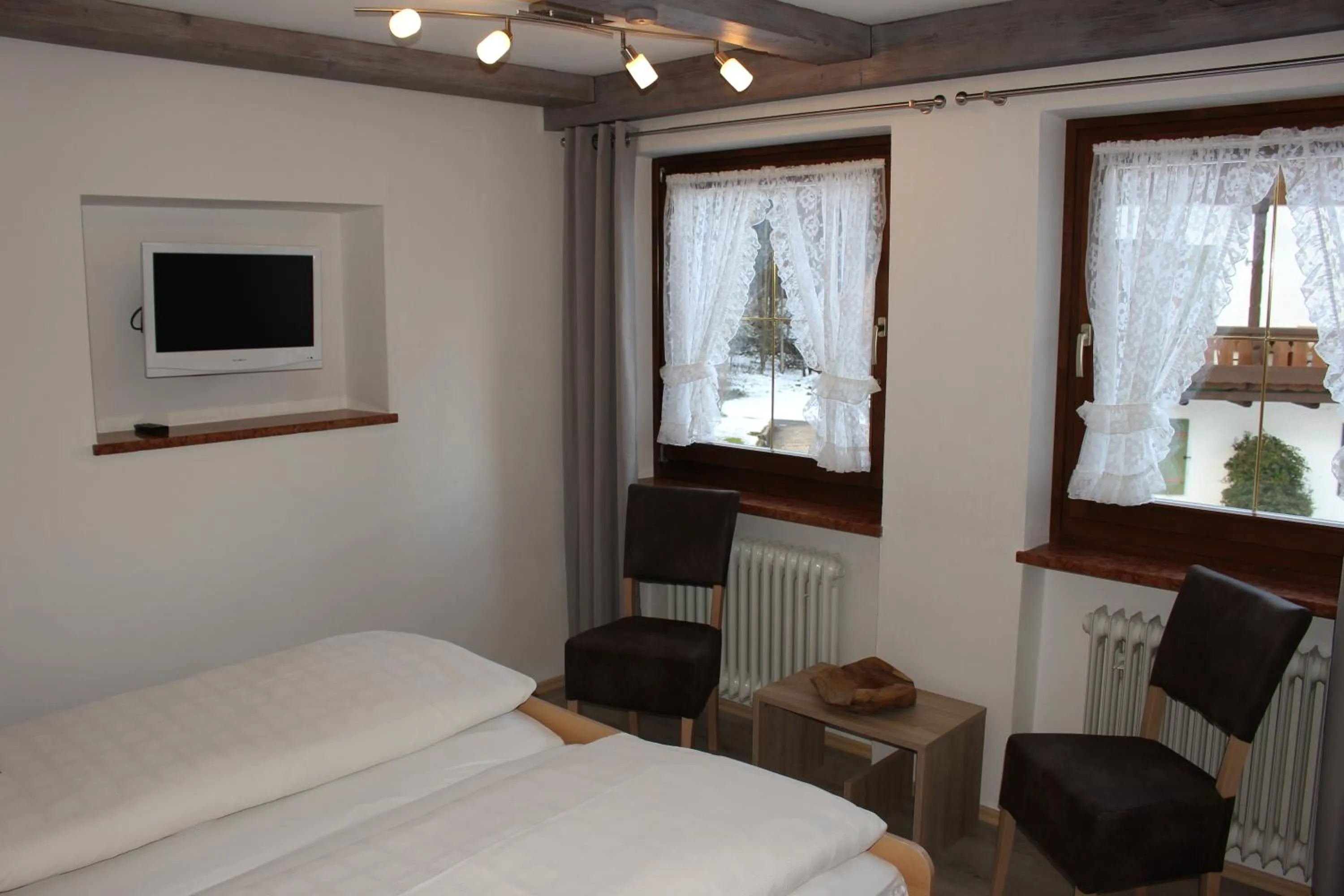 Seating area, Bed in Gästehaus Stöckl