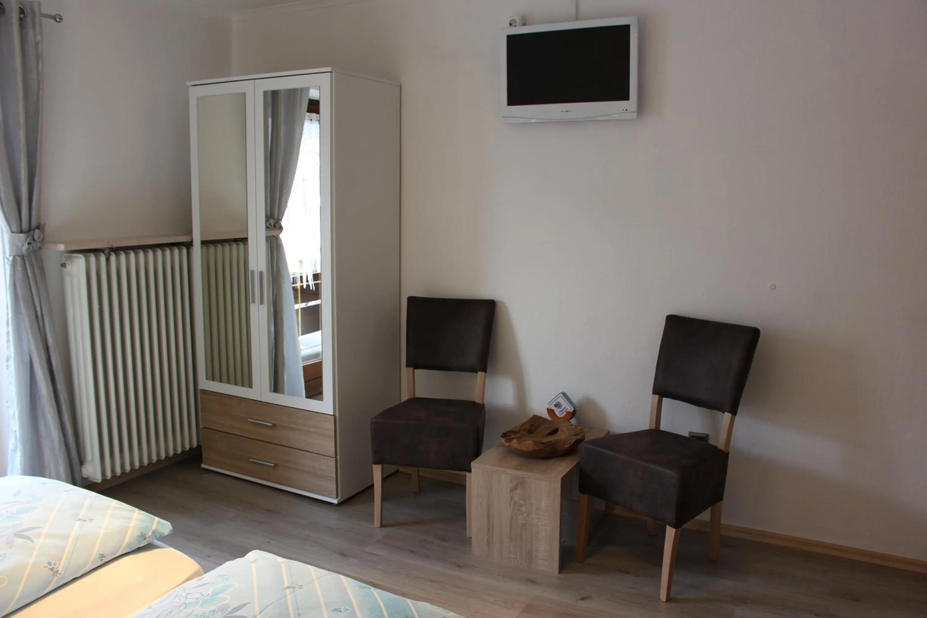 Seating area, Bed in Gästehaus Stöckl