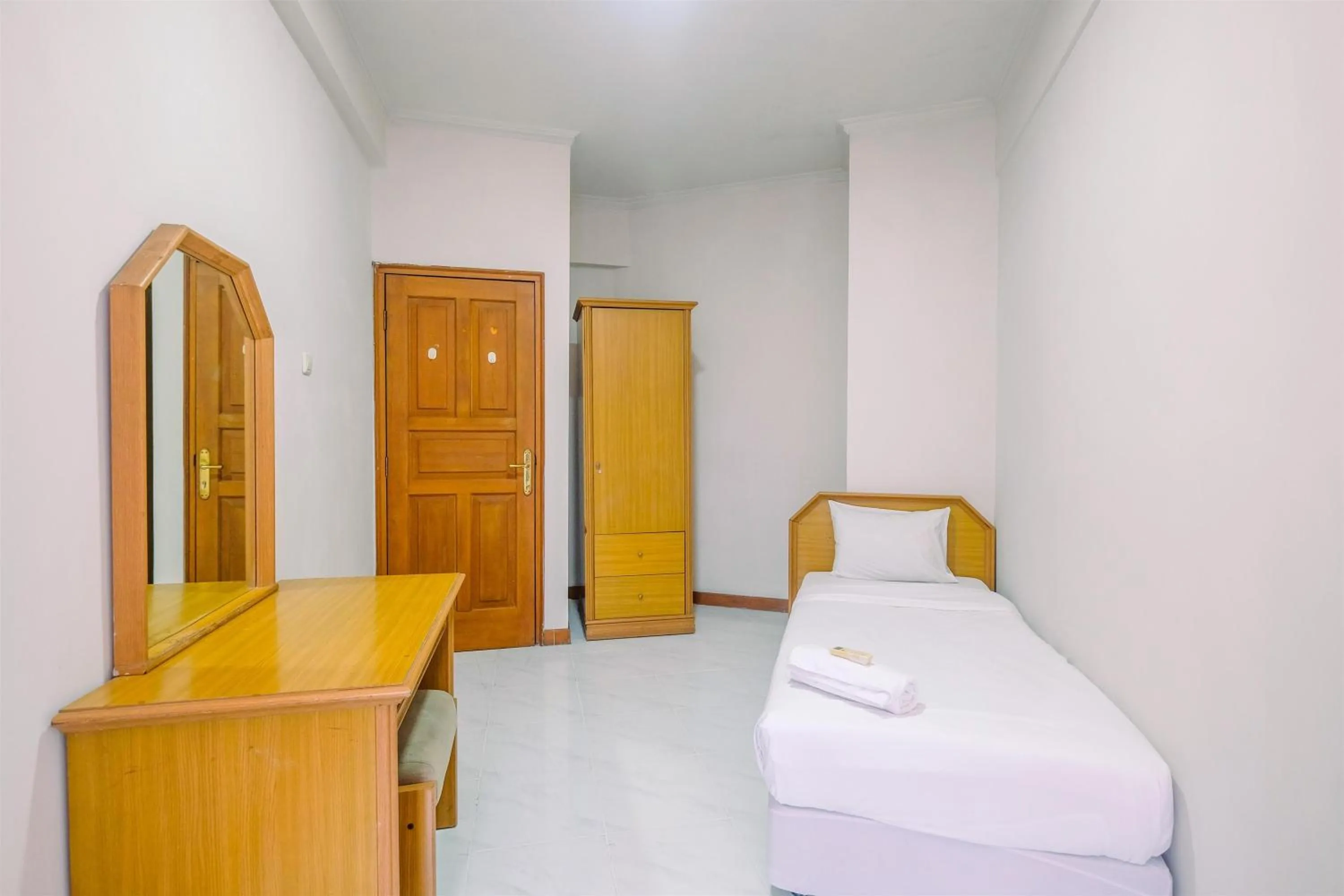 Bedroom in Spacious and Strategic 3BR Kondominium Juanda Apartment By Travelio