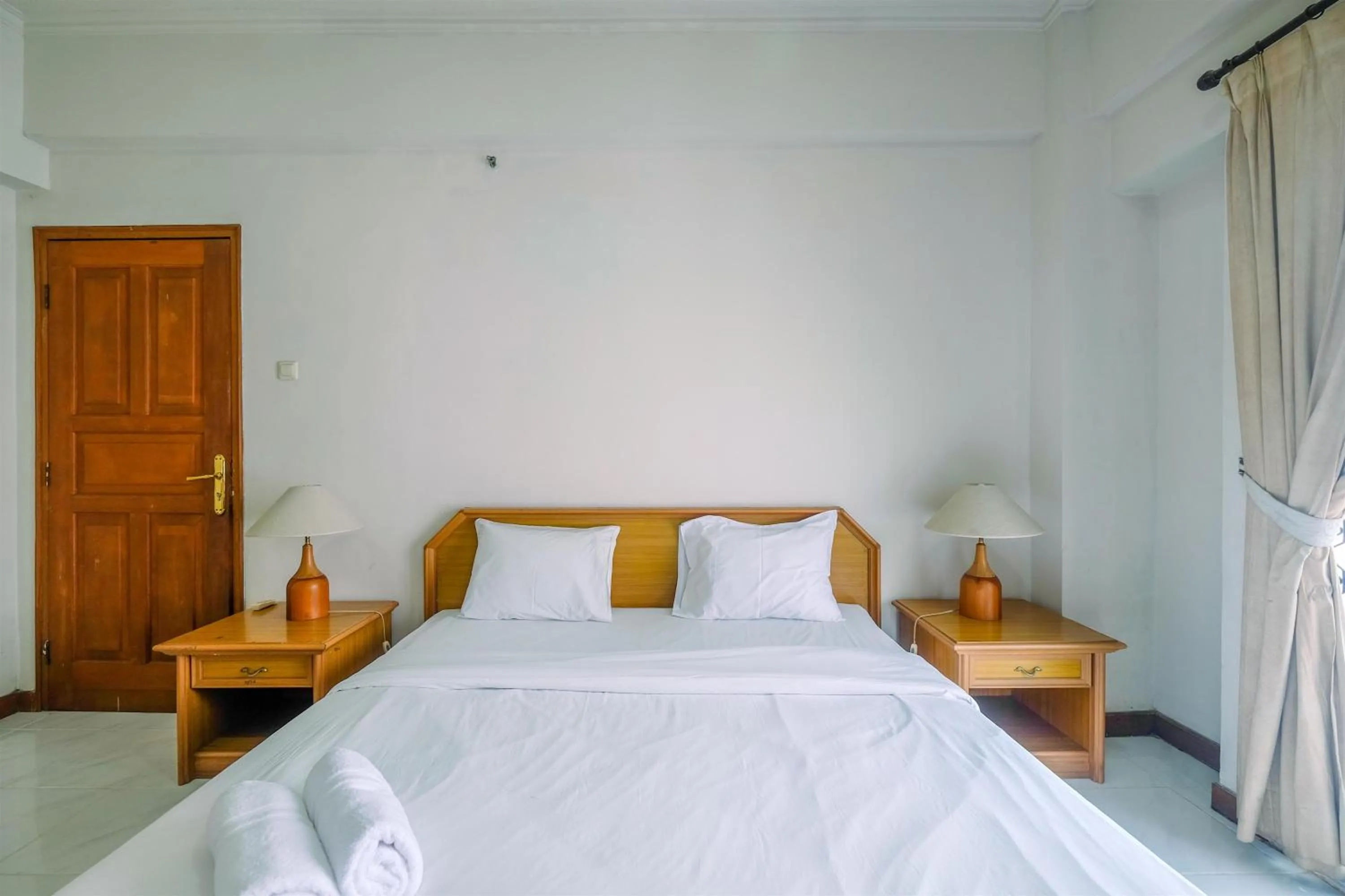 Bedroom in Spacious and Strategic 3BR Kondominium Juanda Apartment By Travelio