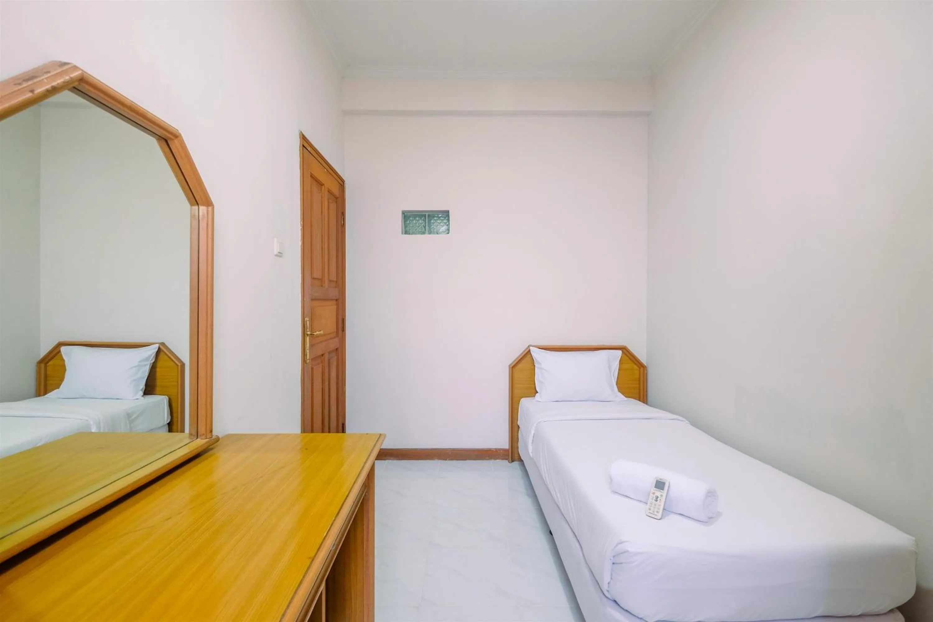Bedroom in Spacious and Strategic 3BR Kondominium Juanda Apartment By Travelio