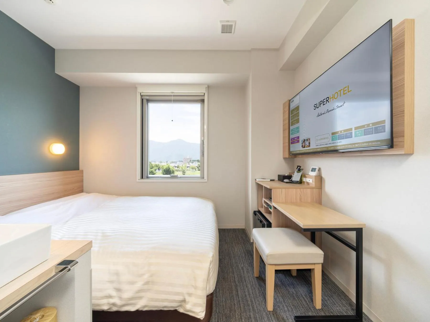 Bed in Super Hotel Fujikawaguchiko Tennenonsen