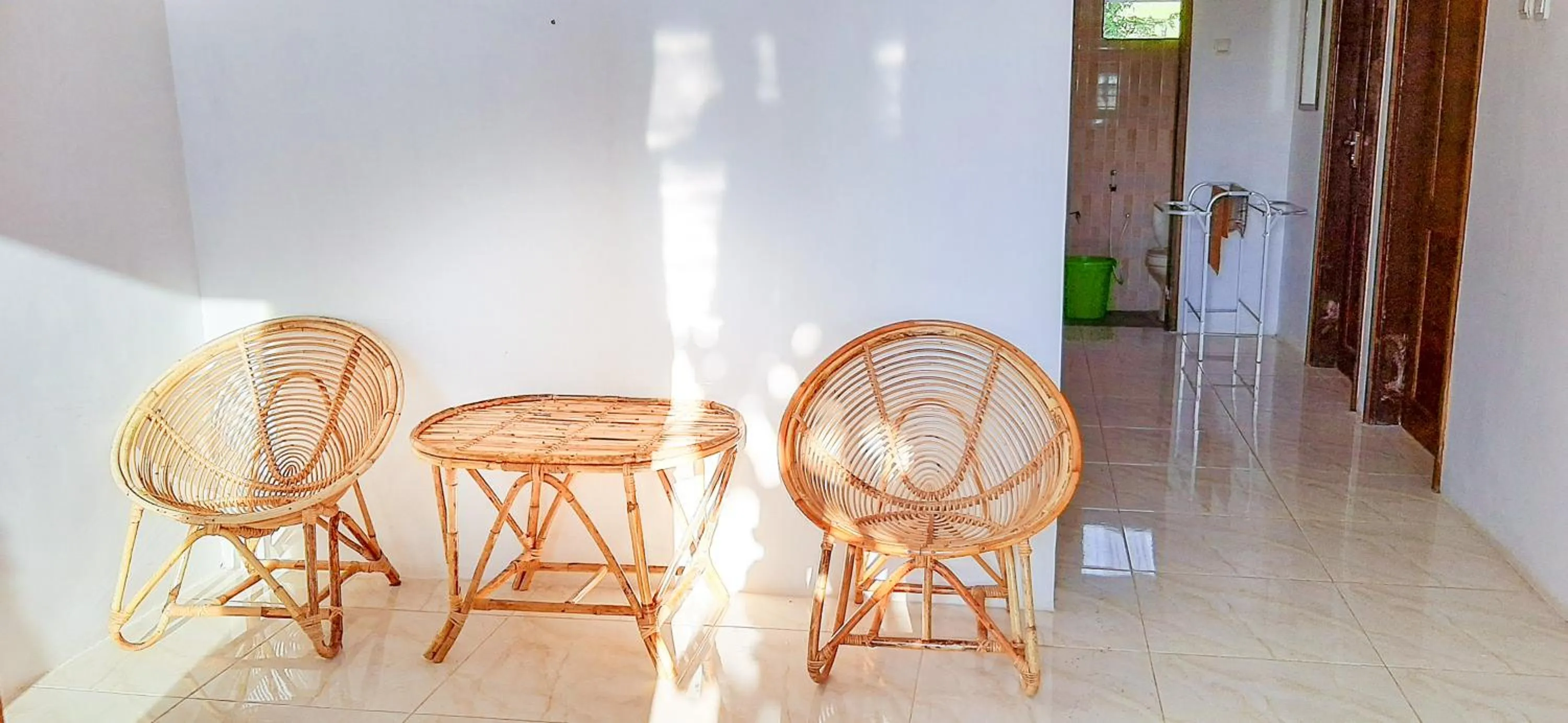 Seating area in Villa Kebun Jeruk Syariah Malang by ecommerceloka