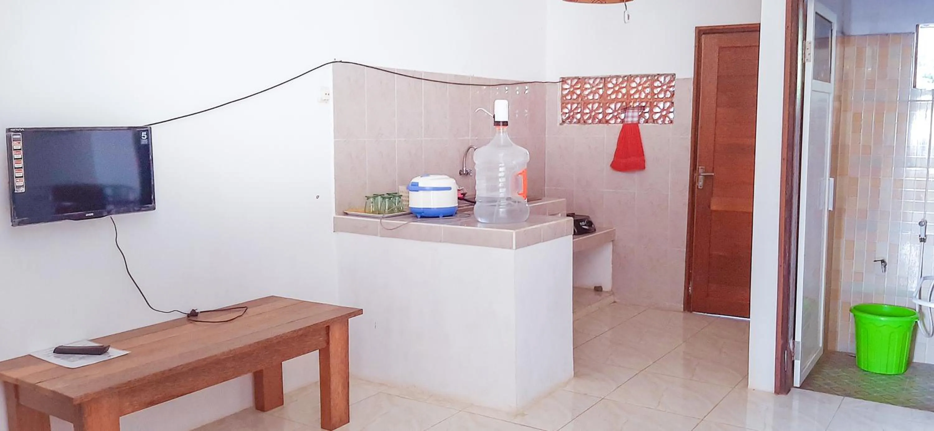 Communal lounge/ TV room in Villa Kebun Jeruk Syariah Malang by ecommerceloka