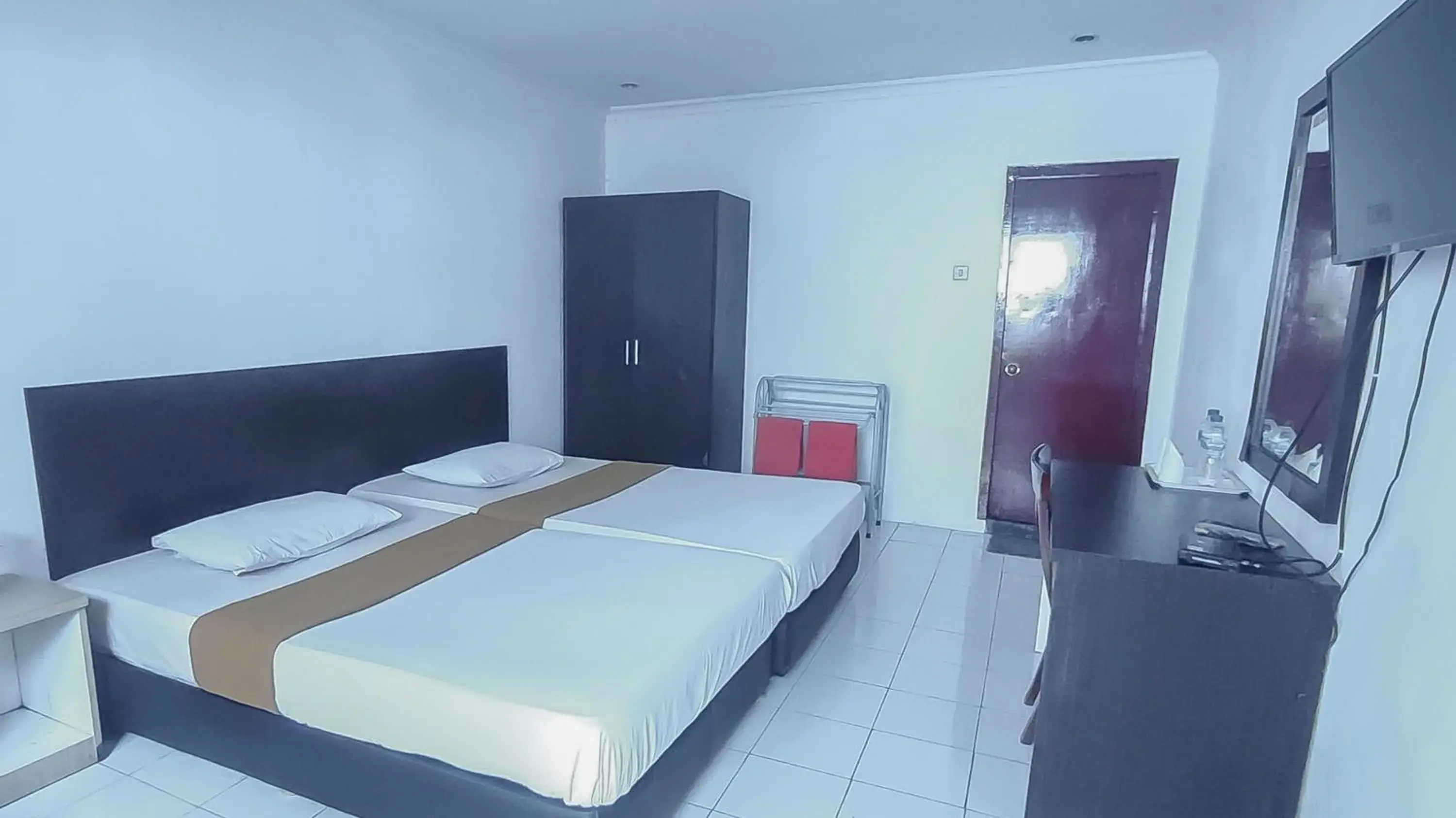 Bed in Burangrang Village Mitra RedDoorz Bed in Burangrang Village Mitra RedDoorz