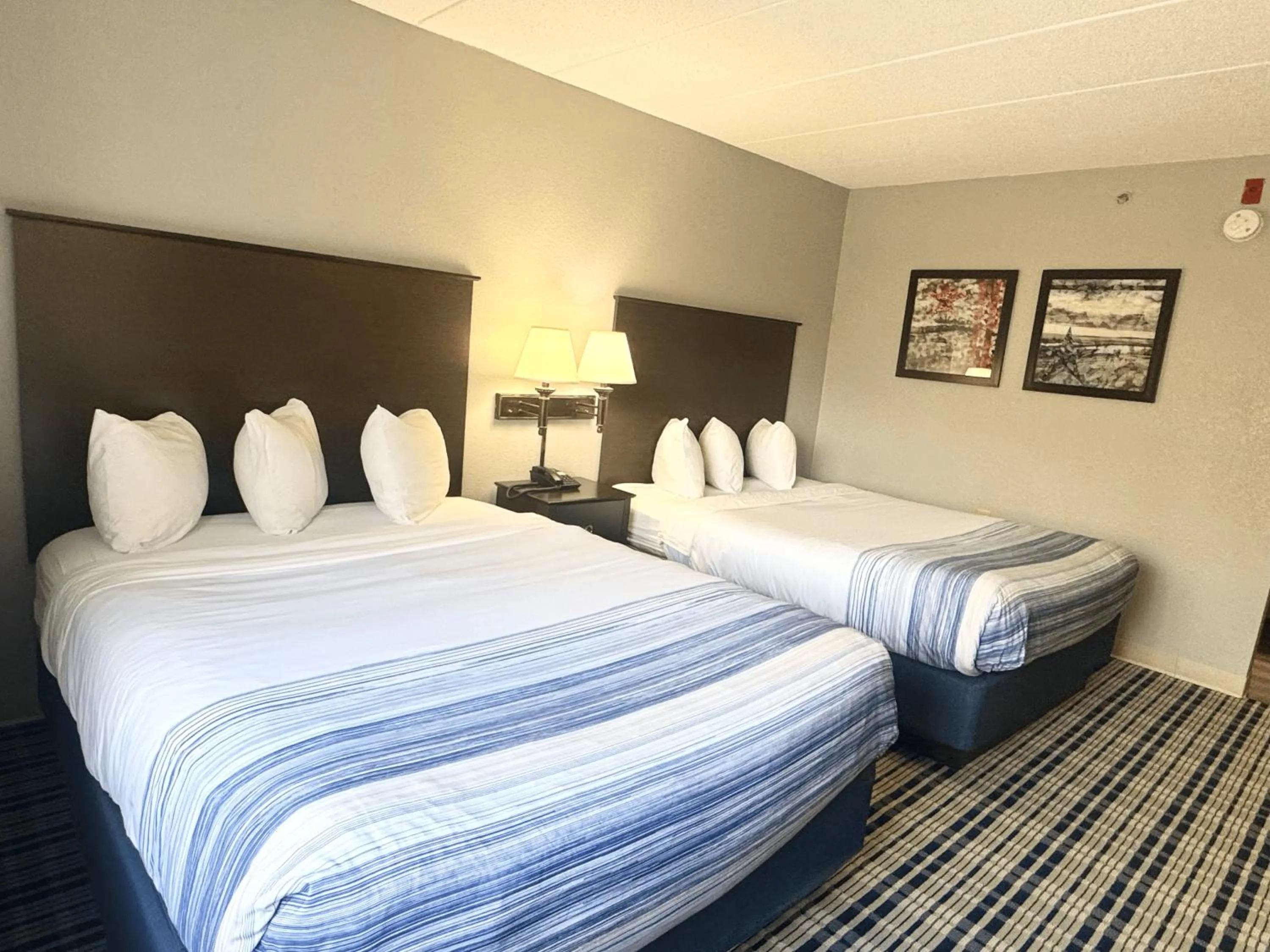 Bed in AmericInn by Wyndham Ames