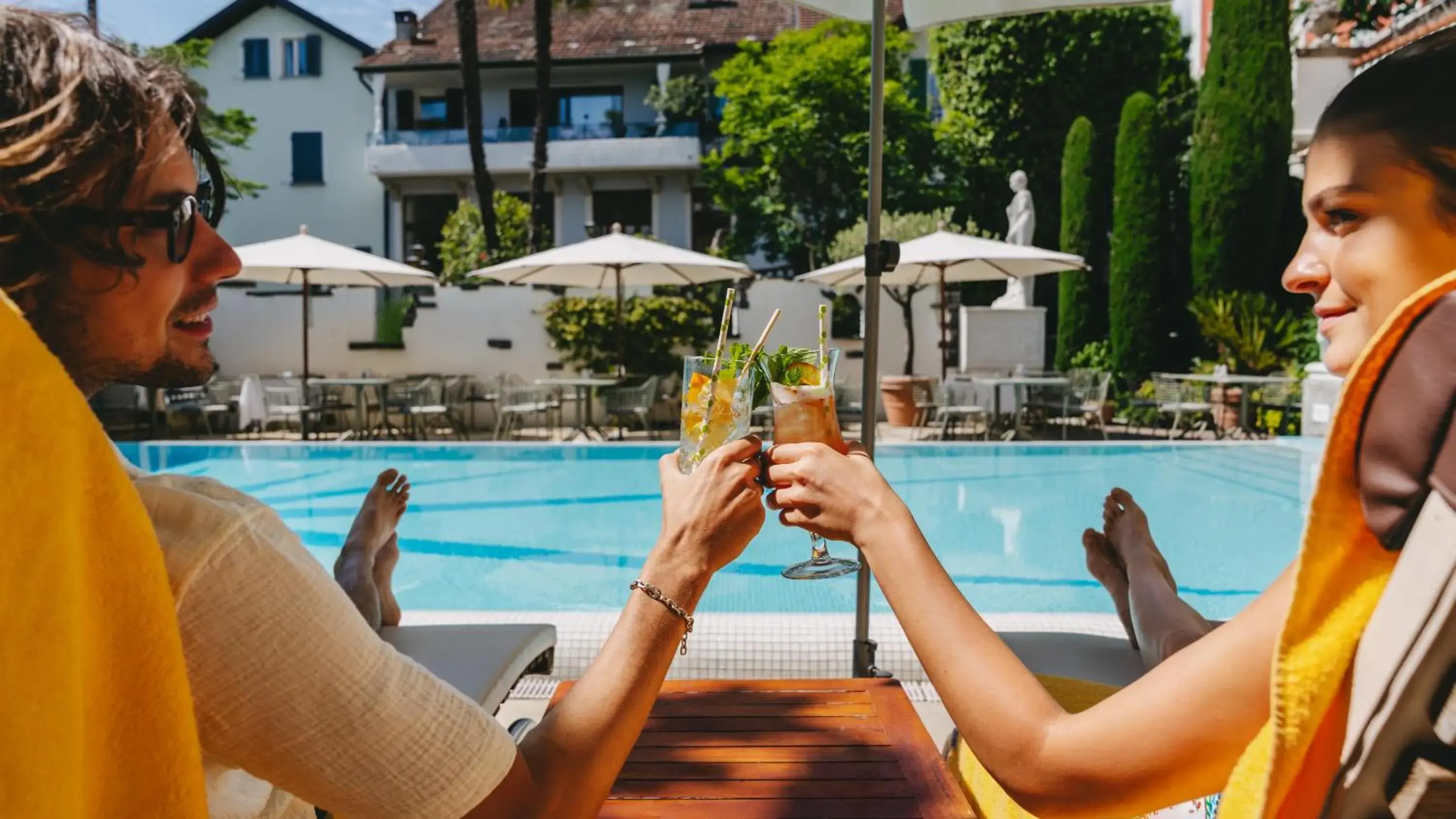 Pool view in Boutique Hotel Sunstar Brissago am Lago Maggiore Pool view in Boutique Hotel Sunstar Brissago am Lago Maggiore