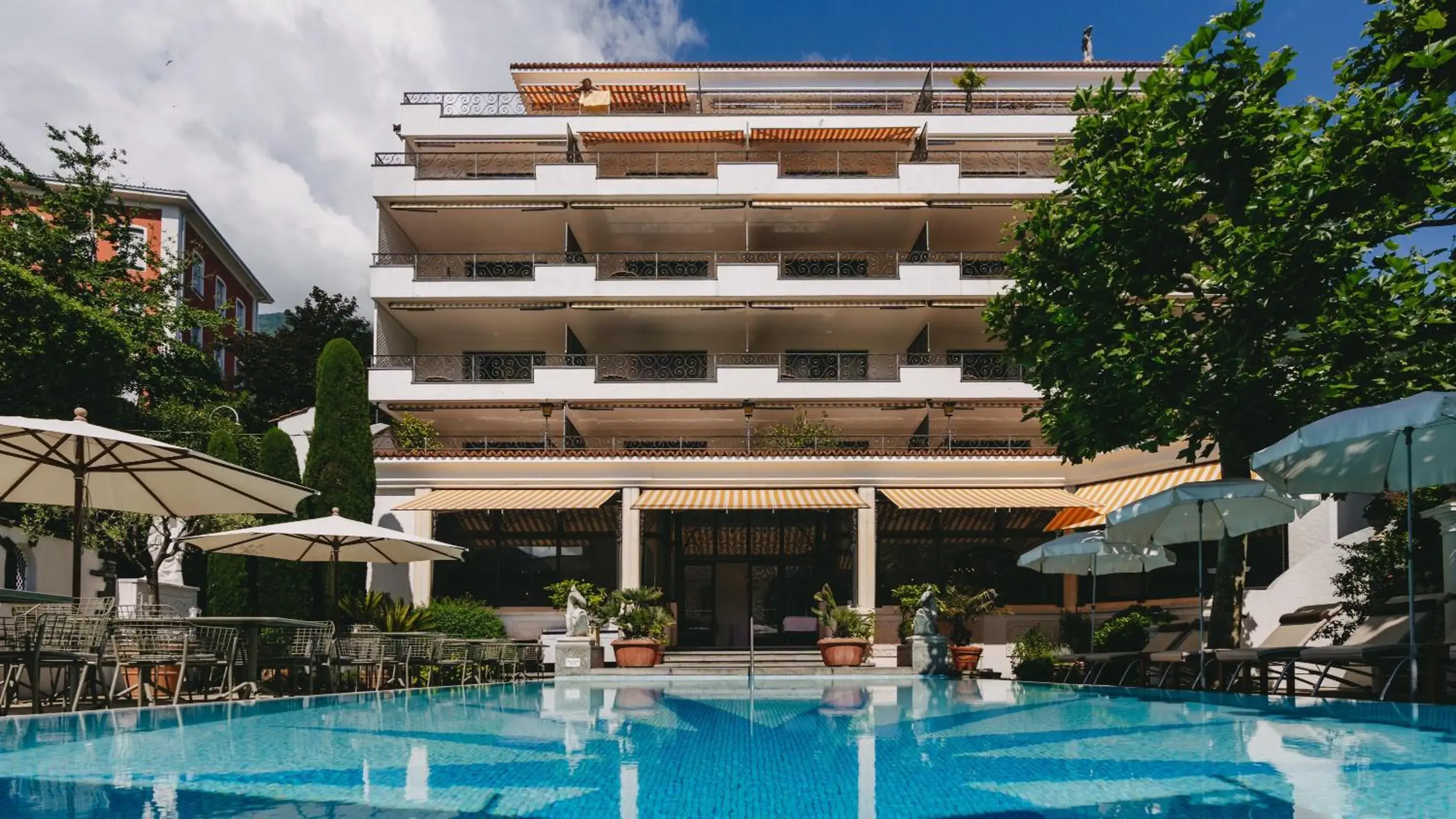 Pool view in Boutique Hotel Sunstar Brissago am Lago Maggiore Pool view in Boutique Hotel Sunstar Brissago am Lago Maggiore