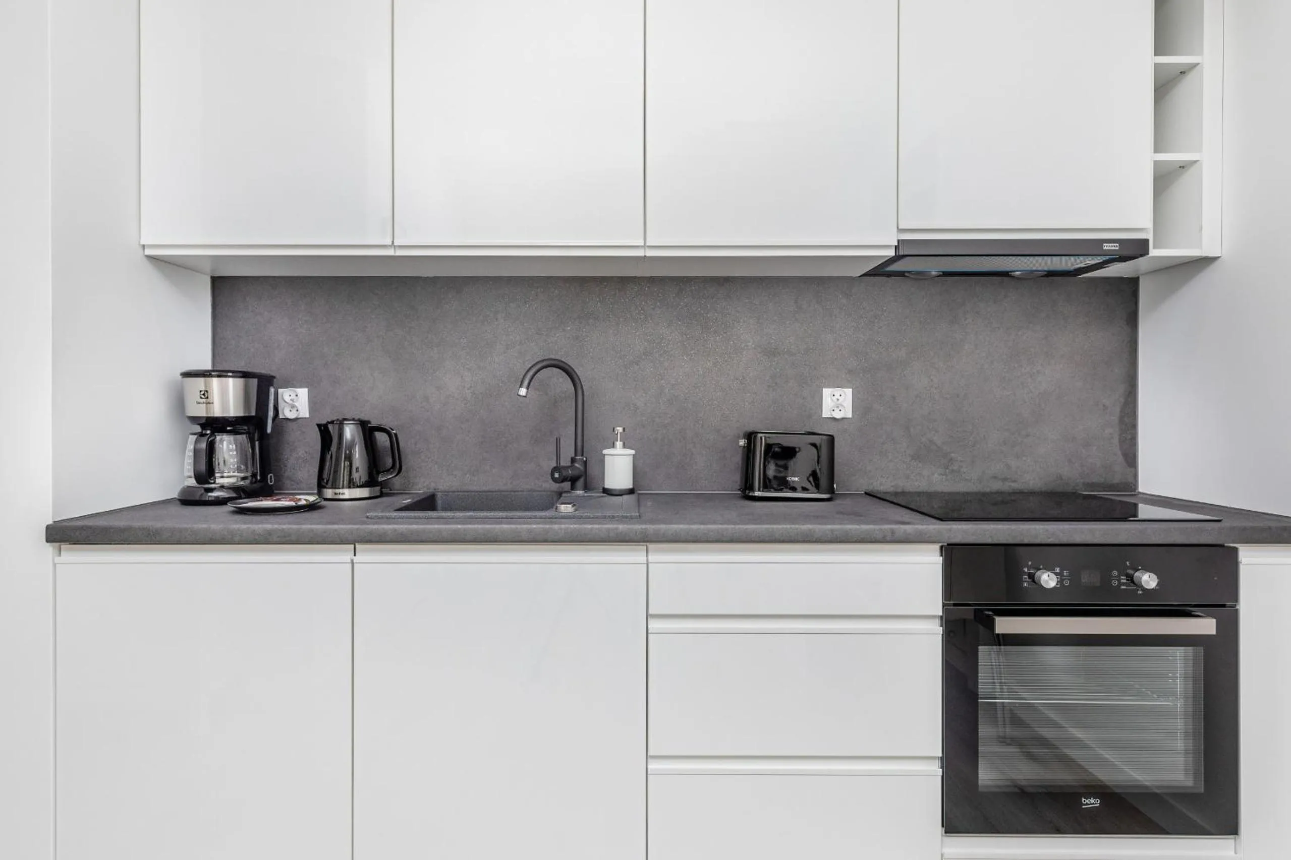 Kitchen or kitchenette in Apartamenty Osiedle Bursztynowe II by Noclegi Renters